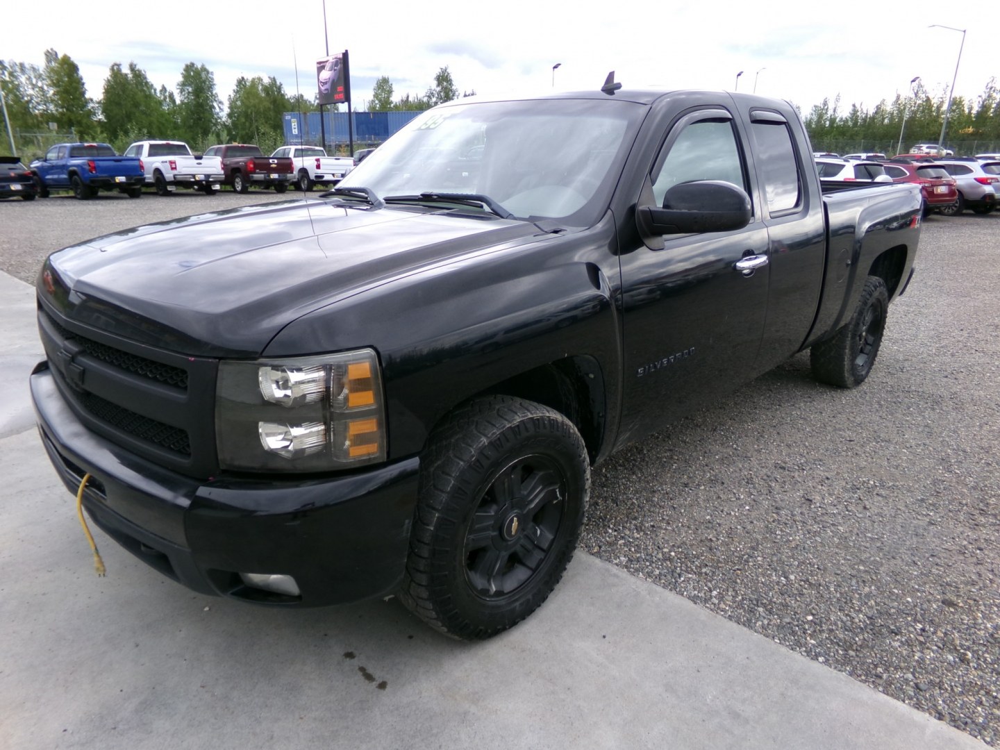2010 Black Chevrolet Silverado 1500 LTZ Ext. Cab Long Box 4WD (1GCSKTE38AZ) with an 5.3L V8 OHV 16V FFV engine, 4-Speed Automatic transmission, located at 2630 Philips Field Rd., Fairbanks, AK, 99709, (907) 458-0593, 64.848068, -147.780609- Photo#0