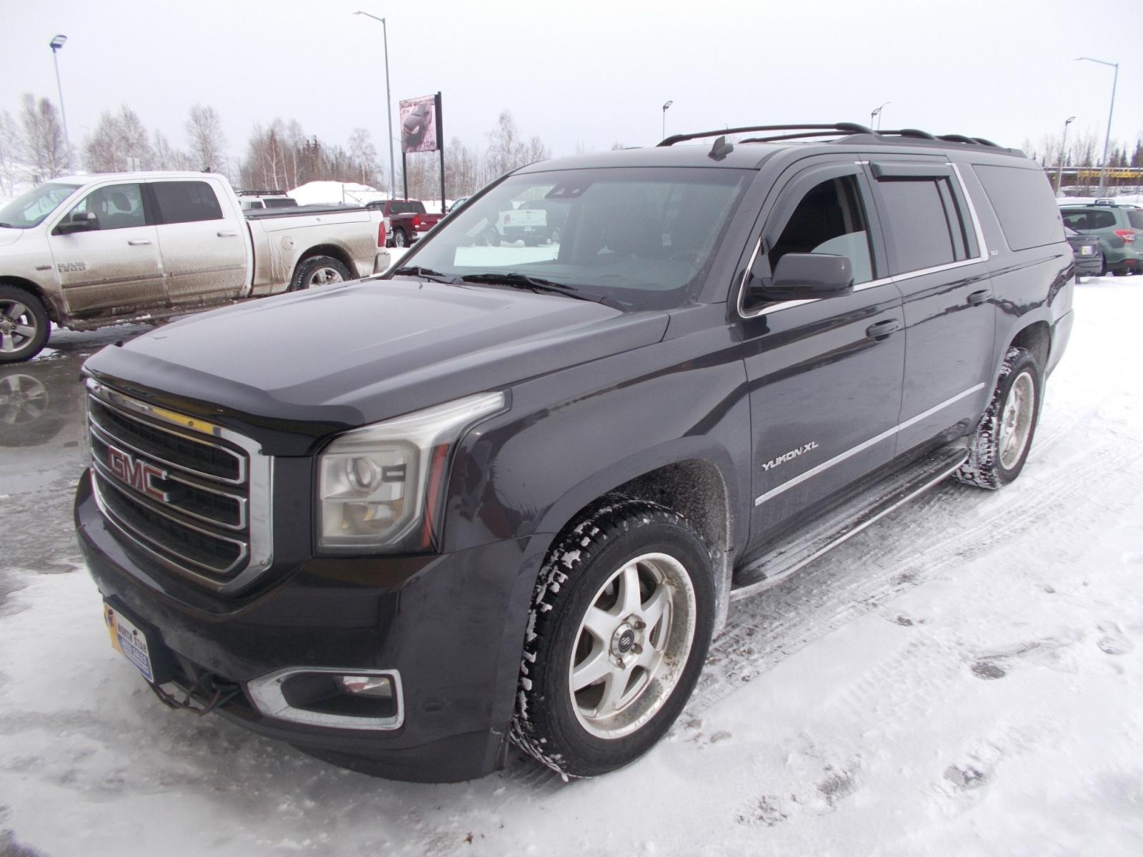 2015 Black GMC Yukon XL SLT 1/2 Ton 4WD (1GKS2HKC6FR) with an 5.3L V8 OHV 16V engine, 6-Speed Automatic transmission, located at 2630 Philips Field Rd., Fairbanks, AK, 99709, (907) 458-0593, 64.848068, -147.780609 - Photo #0