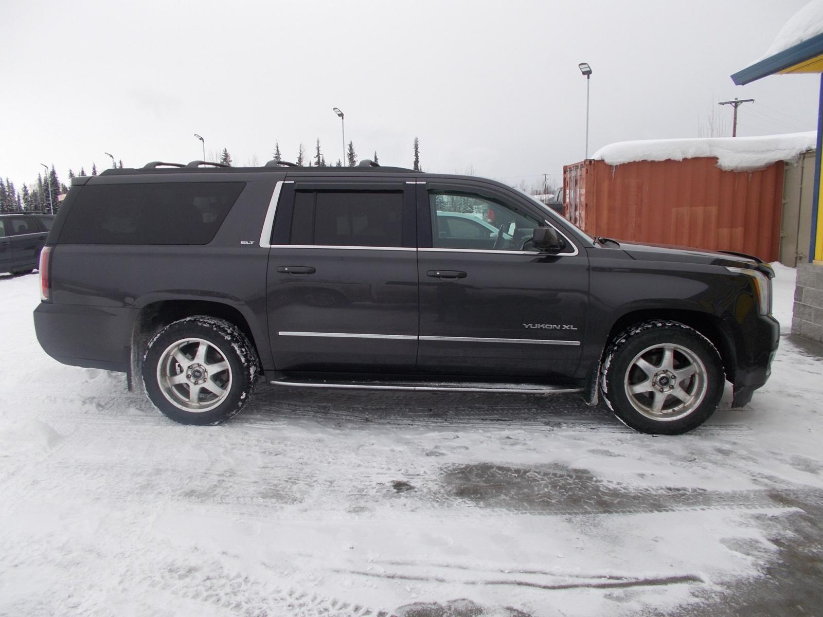 2015 Black GMC Yukon XL SLT 1/2 Ton 4WD (1GKS2HKC6FR) with an 5.3L V8 OHV 16V engine, 6-Speed Automatic transmission, located at 2630 Philips Field Rd., Fairbanks, AK, 99709, (907) 458-0593, 64.848068, -147.780609 - Photo #2