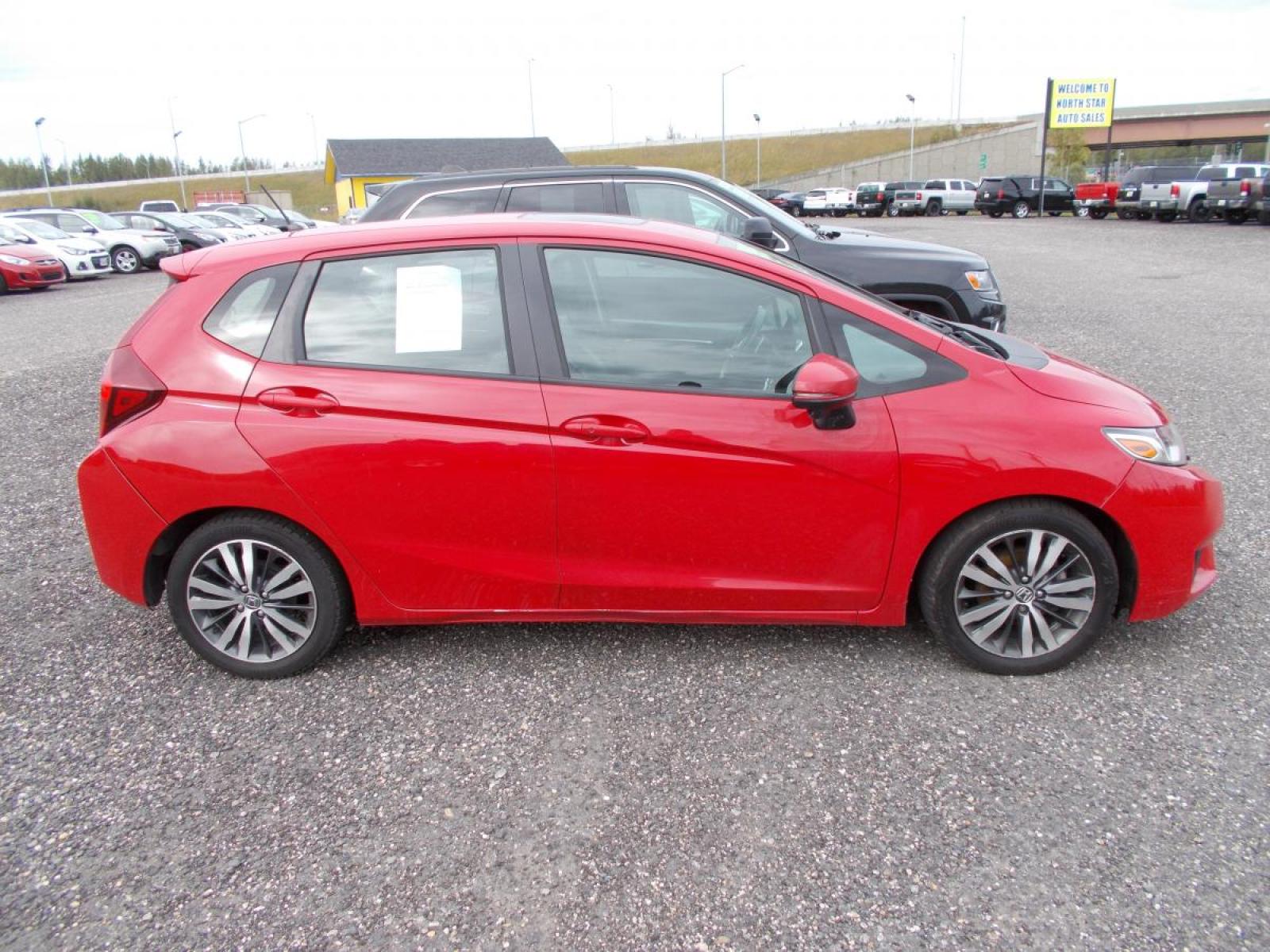 2015 Red Honda Fit EX CVT (3HGGK5H88FM) with an 1.5L L4 SOHC 16V engine, Continuously Variable Transmission transmission, located at 2630 Philips Field Rd., Fairbanks, AK, 99709, (907) 458-0593, 64.848068, -147.780609 - Photo #2