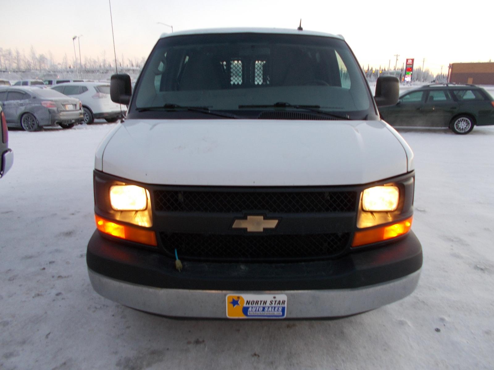2014 White Chevrolet Express 1500 AWD Cargo (1GCSHAF44E1) with an 5.3L V8 OHV 16V engine, 4-Speed Automatic transmission, located at 2630 Philips Field Rd., Fairbanks, AK, 99709, (907) 458-0593, 64.848068, -147.780609 - Photo #1