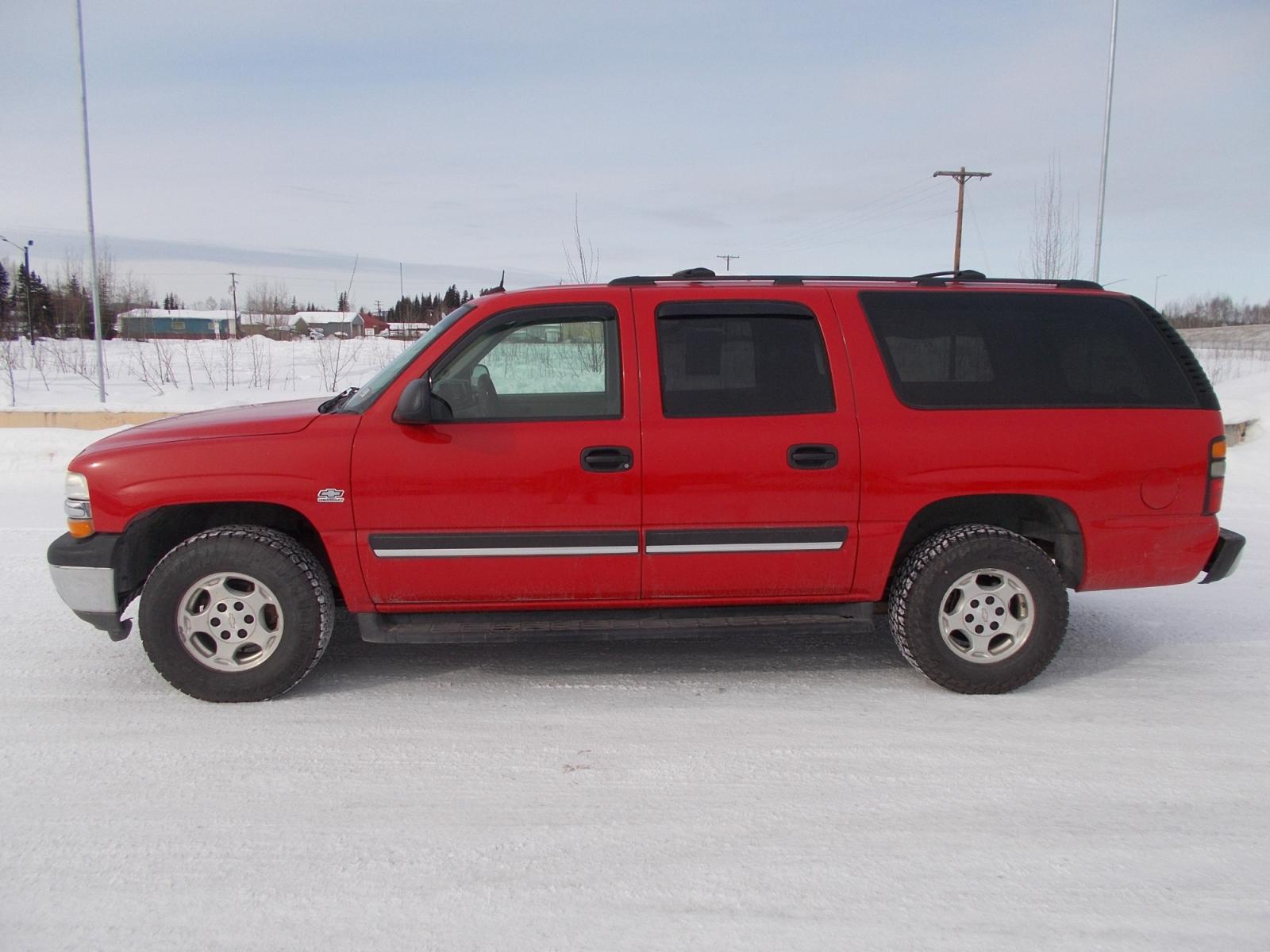 2005 Red Chevrolet Suburban 1500 4WD (1GNFK16Z65J) with an 5.3L V8 OHV 16V FFV engine, 4-Speed Automatic Overdrive transmission, located at 2630 Philips Field Rd., Fairbanks, AK, 99709, (907) 458-0593, 64.848068, -147.780609 - Photo #2