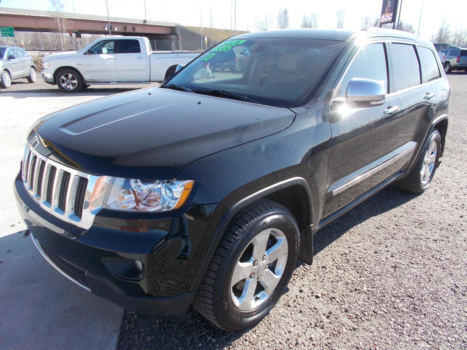 2013 Black Jeep Grand Cherokee Limited 4WD (1C4RJFBG2DC) with an 3.6L V6 DOHC 24V engine, 5-Speed Automatic transmission, located at 2630 Philips Field Rd., Fairbanks, AK, 99709, (907) 458-0593, 64.848068, -147.780609 - Photo #0