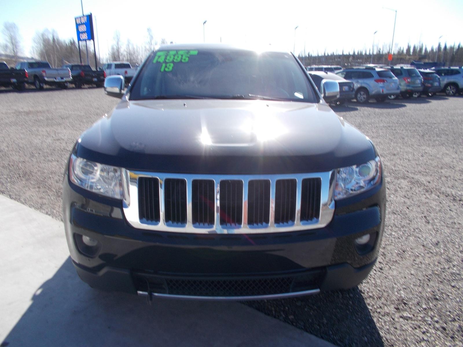 2013 Black Jeep Grand Cherokee Limited 4WD (1C4RJFBG2DC) with an 3.6L V6 DOHC 24V engine, 5-Speed Automatic transmission, located at 2630 Philips Field Rd., Fairbanks, AK, 99709, (907) 458-0593, 64.848068, -147.780609 - Photo #1