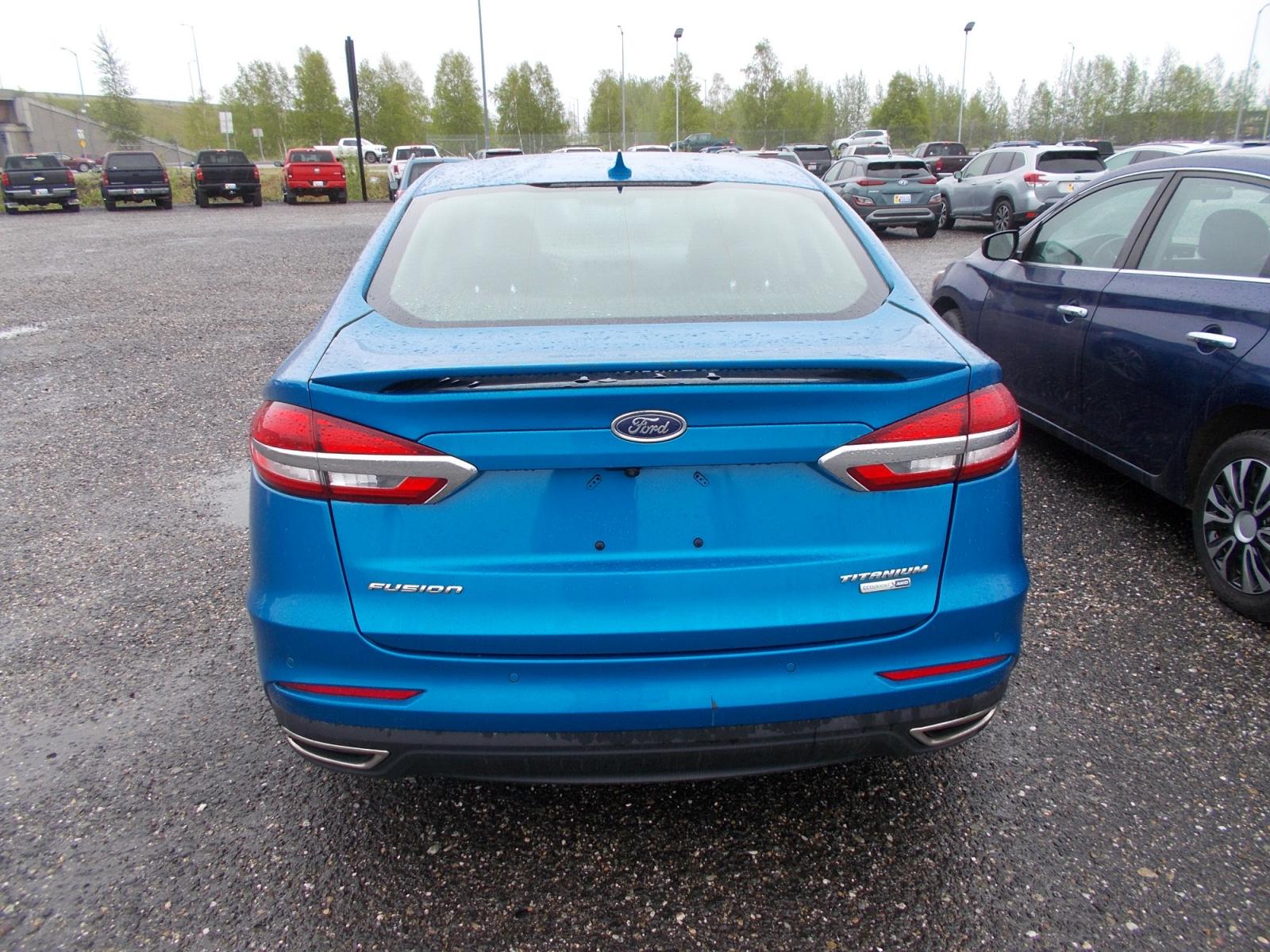 2020 Blue Ford Fusion Titanium AWD (3FA6P0D90LR) with an 2.0L L4 DOHC 16V engine, 6A transmission, located at 2630 Philips Field Rd., Fairbanks, AK, 99709, (907) 458-0593, 64.848068, -147.780609 - Photo #3