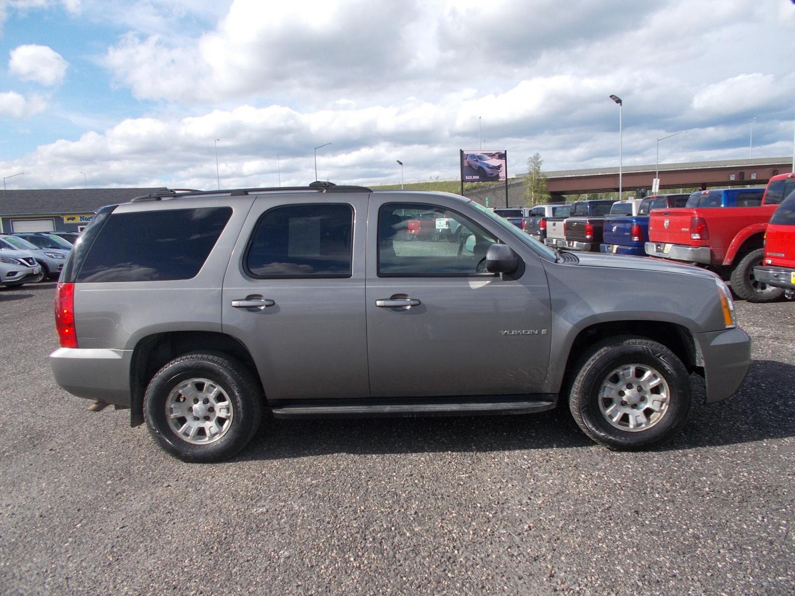 2007 Grey GMC Yukon 4WD (1GKFK13067J) with an 5.3L V8 OHV 16V FFV engine, 4-Speed Automatic Overdrive transmission, located at 2630 Philips Field Rd., Fairbanks, AK, 99709, (907) 458-0593, 64.848068, -147.780609 - Photo #2