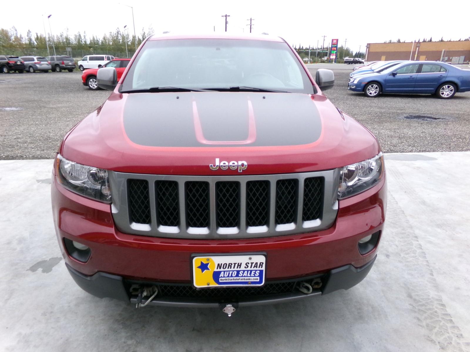 2013 Red Jeep Grand Cherokee Laredo 4WD (1C4RJFAG7DC) with an 3.6L V6 DOHC 24V engine, 5-Speed Automatic transmission, located at 2630 Philips Field Rd., Fairbanks, AK, 99709, (907) 458-0593, 64.848068, -147.780609 - Photo #1