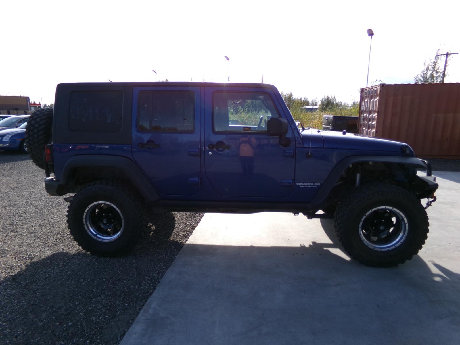 2010 Blue Jeep Wrangler Unlimited Rubicon 4WD (1J4BA6H18AL) with an 3.8L V6 OHV 12V engine, located at 2630 Philips Field Rd., Fairbanks, AK, 99709, (907) 458-0593, 64.848068, -147.780609 - Photo #2