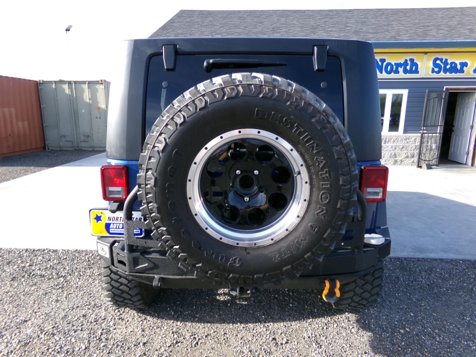 2010 Blue Jeep Wrangler Unlimited Rubicon 4WD (1J4BA6H18AL) with an 3.8L V6 OHV 12V engine, located at 2630 Philips Field Rd., Fairbanks, AK, 99709, (907) 458-0593, 64.848068, -147.780609 - Photo #3