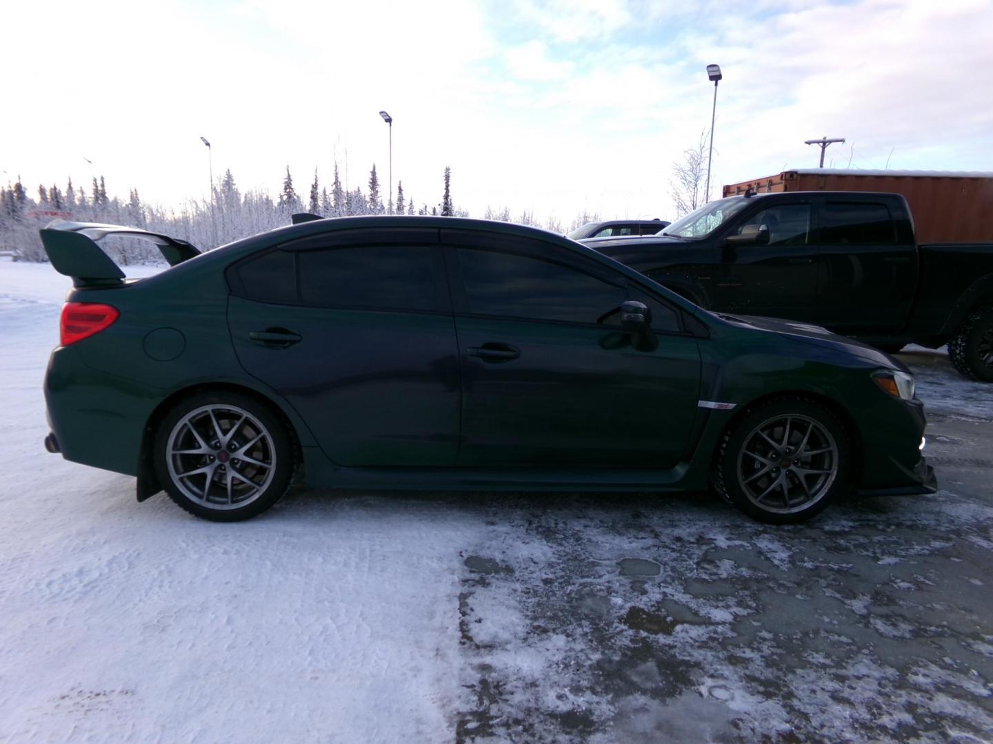 2015 Green /Black Subaru WRX STI 4-Door (JF1VA2U69F9) with an 2.5L H4 DOHC 16V engine, 6-Speed Manual transmission, located at 2630 Philips Field Rd., Fairbanks, AK, 99709, (907) 458-0593, 64.848068, -147.780609 - Photo#3