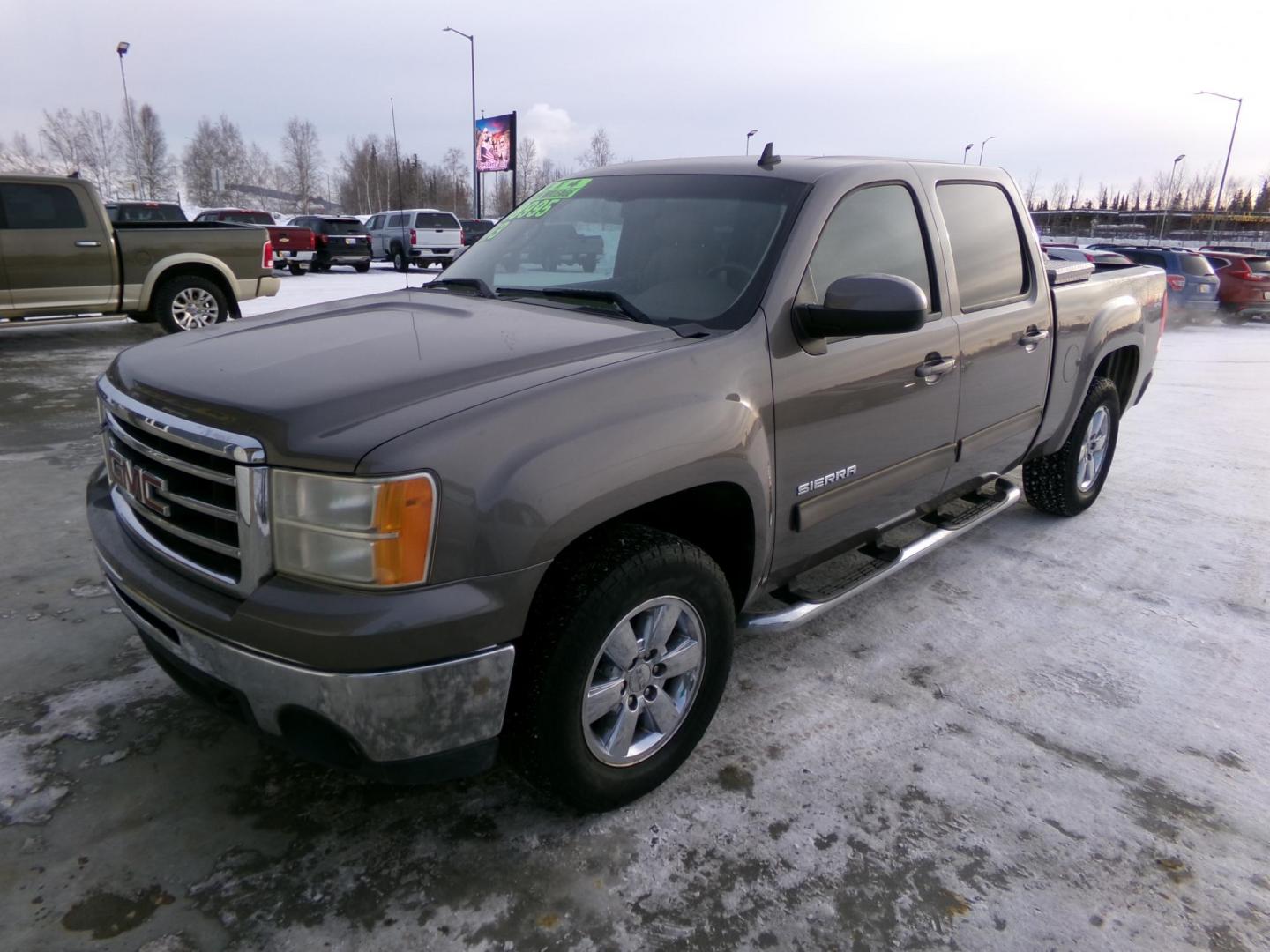 2013 Tan GMC Sierra 1500 SLT Crew Cab 4WD (3GTP2WE70DG) with an 5.3L V8 OHV 16V FFV engine, 6-Speed Automatic transmission, located at 2630 Philips Field Rd., Fairbanks, AK, 99709, (907) 458-0593, 64.848068, -147.780609 - Photo#0