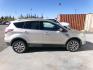 2017 Gold Ford Escape Titanium FWD (1FMCU0J96HU) with an 2.0L L4 DOHC 16V engine, 6A transmission, located at 2630 Philips Field Rd., Fairbanks, AK, 99709, (907) 458-0593, 64.848068, -147.780609 - Photo#2