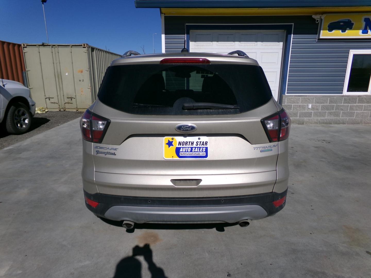 2017 Gold Ford Escape Titanium FWD (1FMCU0J96HU) with an 2.0L L4 DOHC 16V engine, 6A transmission, located at 2630 Philips Field Rd., Fairbanks, AK, 99709, (907) 458-0593, 64.848068, -147.780609 - Photo#3