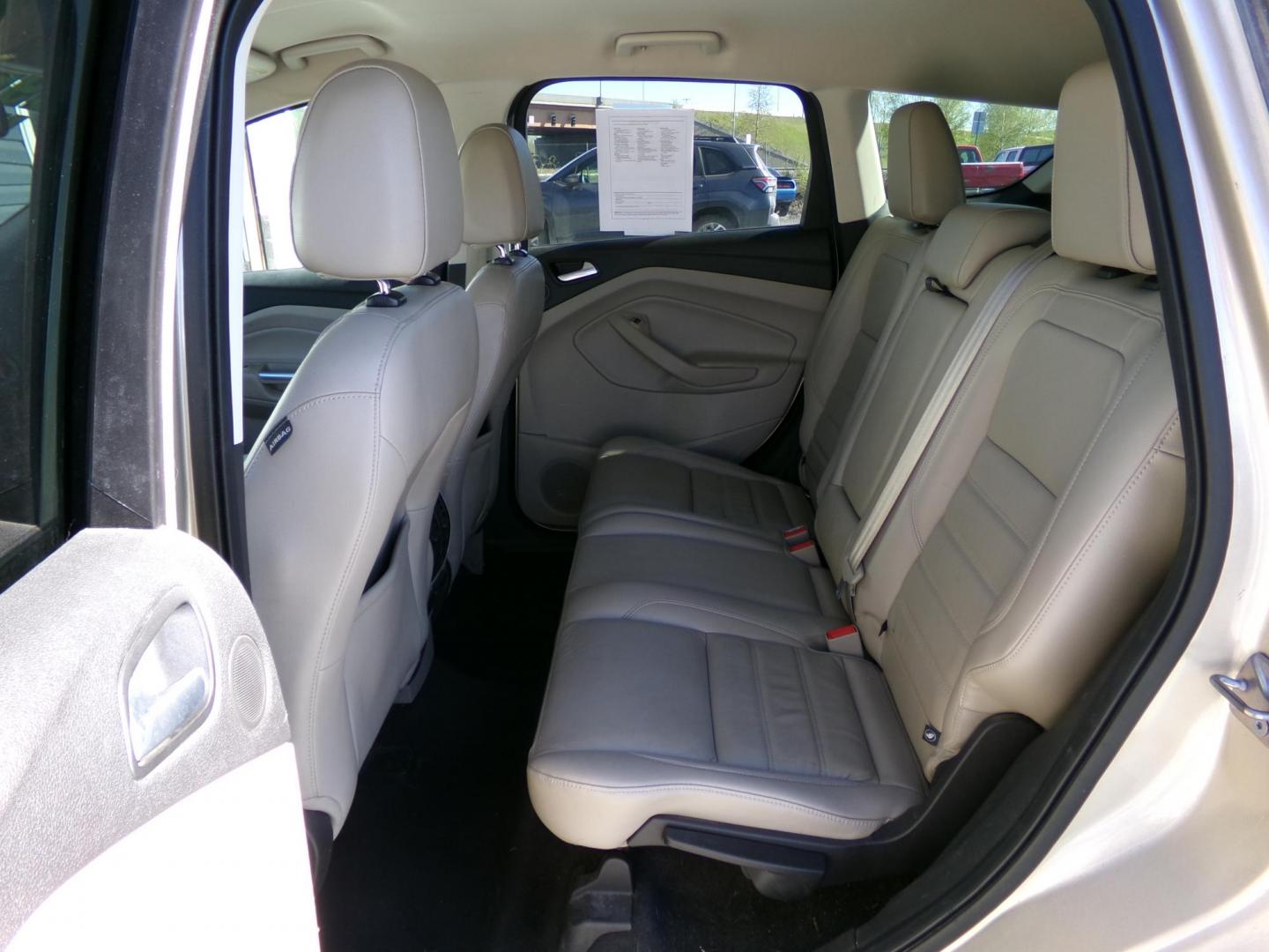 2017 Gold Ford Escape Titanium FWD (1FMCU0J96HU) with an 2.0L L4 DOHC 16V engine, 6A transmission, located at 2630 Philips Field Rd., Fairbanks, AK, 99709, (907) 458-0593, 64.848068, -147.780609 - Photo#5