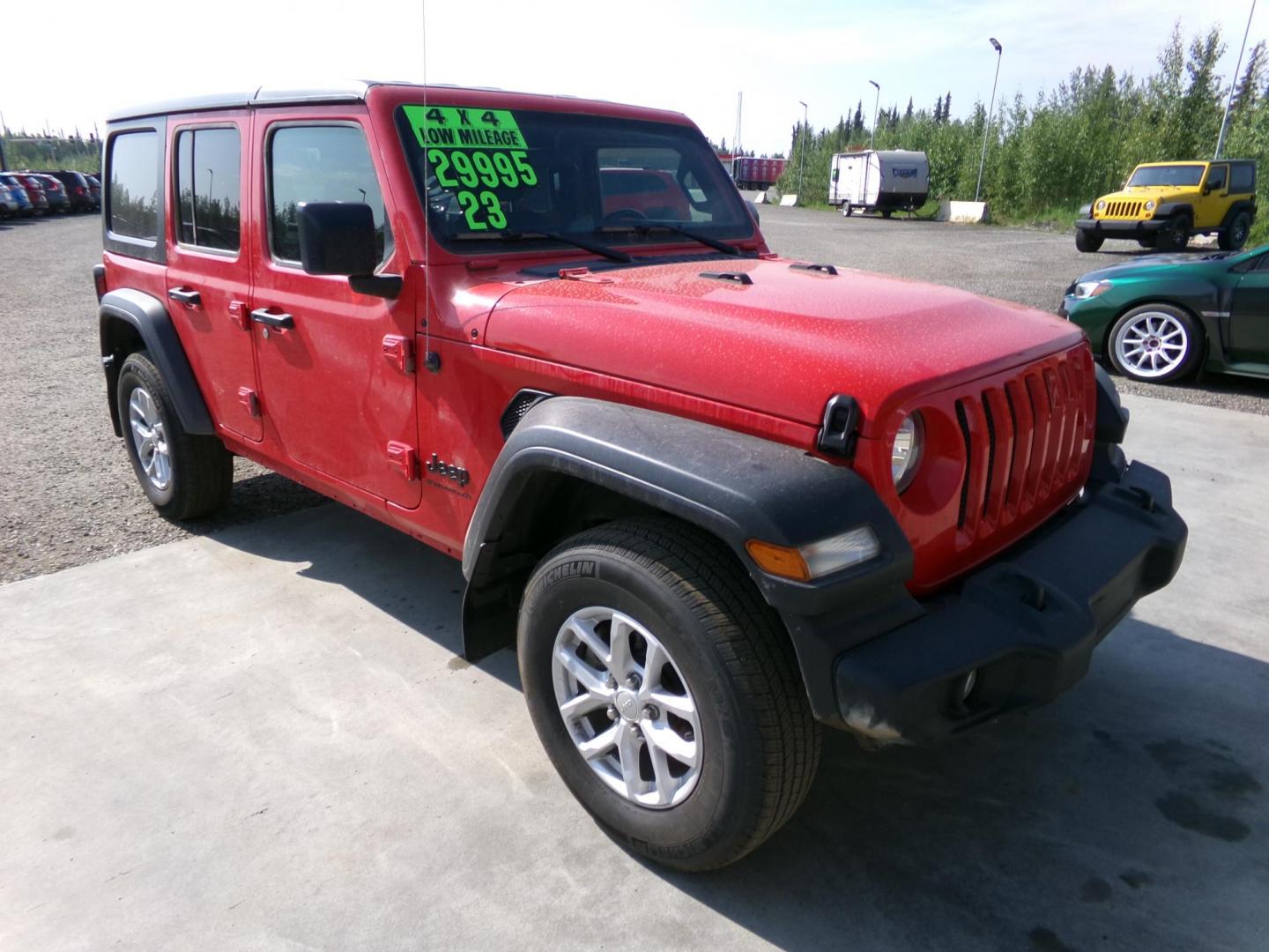 2023 Red Jeep Wrangler Unlimited Sport (1C4HJXDN5PW) with an 2.0L L4 DOHC 16V TURBO engine, 6M transmission, located at 2630 Philips Field Rd., Fairbanks, AK, 99709, (907) 458-0593, 64.848068, -147.780609 - Photo#0