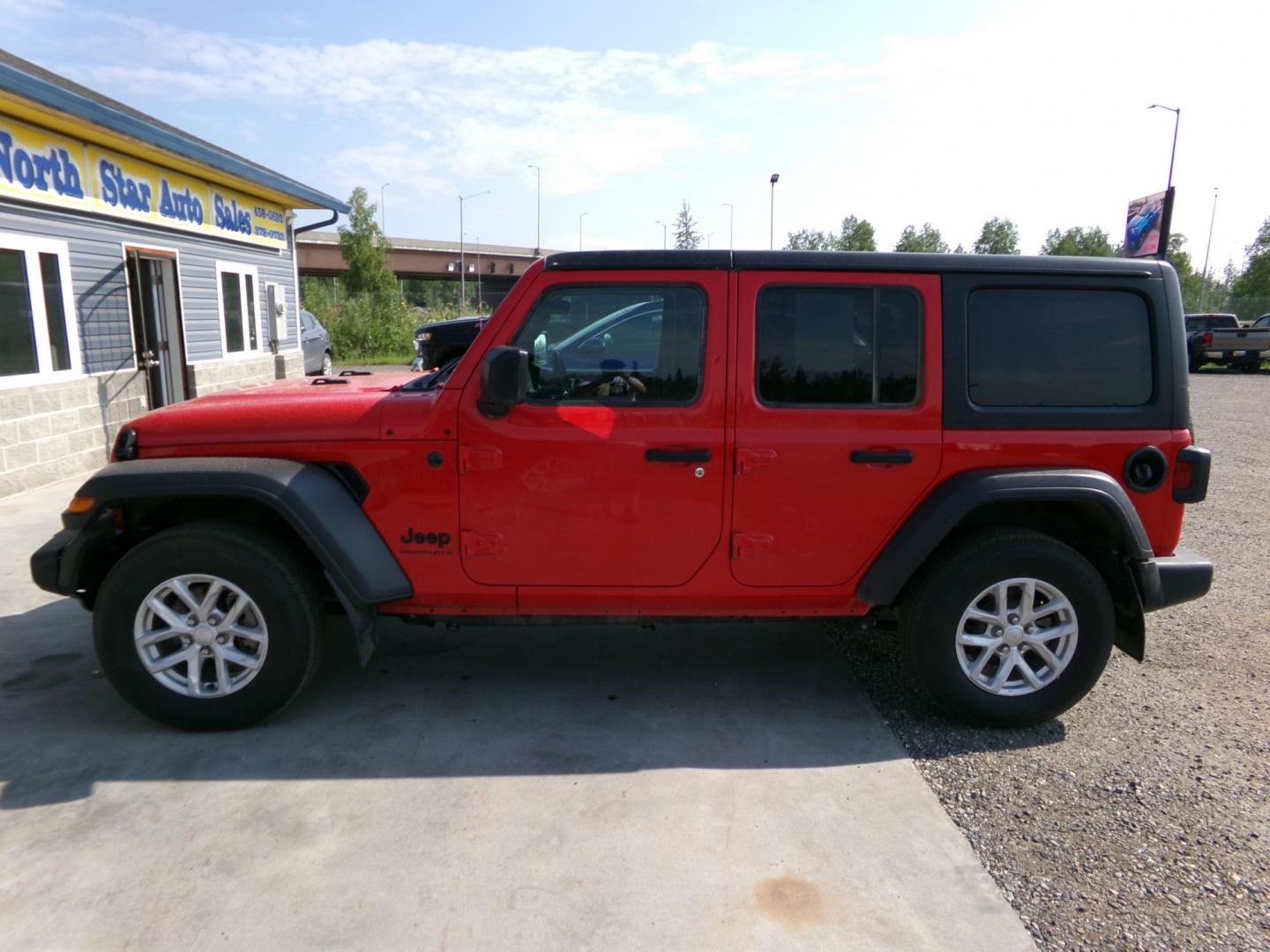 2023 Red Jeep Wrangler Unlimited Sport (1C4HJXDN5PW) with an 2.0L L4 DOHC 16V TURBO engine, 6M transmission, located at 2630 Philips Field Rd., Fairbanks, AK, 99709, (907) 458-0593, 64.848068, -147.780609 - Photo#2