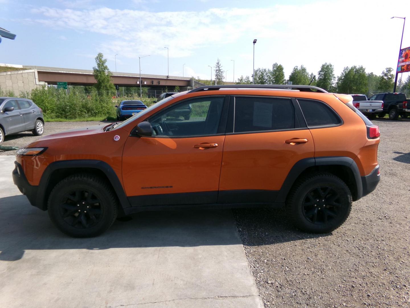 2014 Orange Jeep Cherokee Trailhawk 4WD (1C4PJMBS6EW) with an 3.2L V6 DOHC 24V engine, 9-Speed Automatic transmission, located at 2630 Philips Field Rd., Fairbanks, AK, 99709, (907) 458-0593, 64.848068, -147.780609 - Photo#2