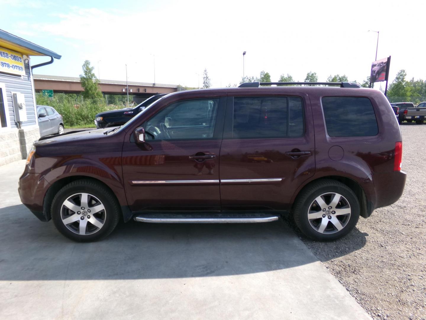 2012 Red Honda Pilot Touring 4WD 5-Spd AT with DVD (5FNYF4H91CB) with an 3.5L V6 SOHC 24V engine, 5-Speed Automatic transmission, located at 2630 Philips Field Rd., Fairbanks, AK, 99709, (907) 458-0593, 64.848068, -147.780609 - Photo#2