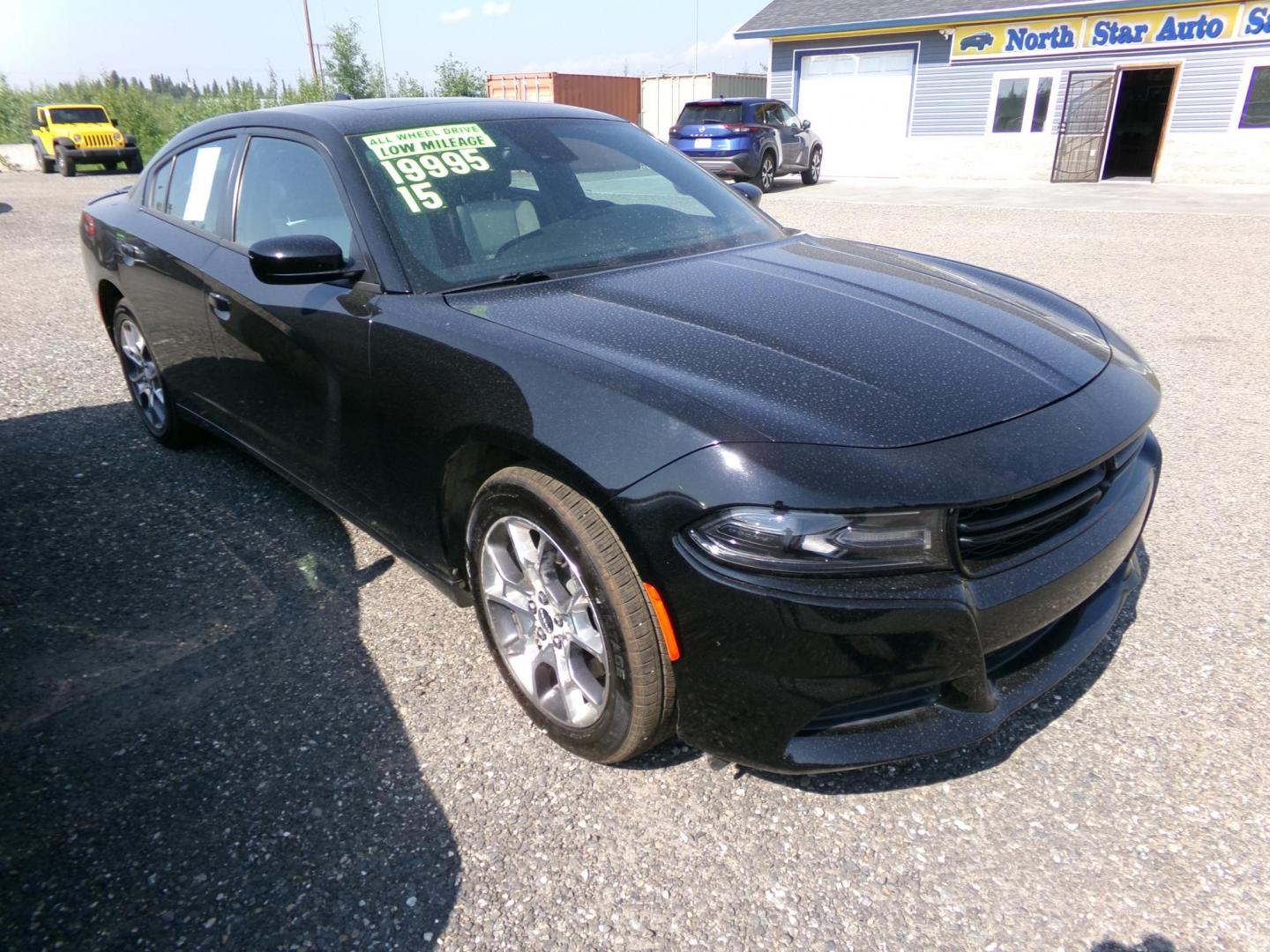 2015 Black Dodge Charger SXT AWD (2C3CDXJG1FH) with an 3.6L V6 DOHC 24V engine, 8-Speed Automatic transmission, located at 2630 Philips Field Rd., Fairbanks, AK, 99709, (907) 458-0593, 64.848068, -147.780609 - Photo#0
