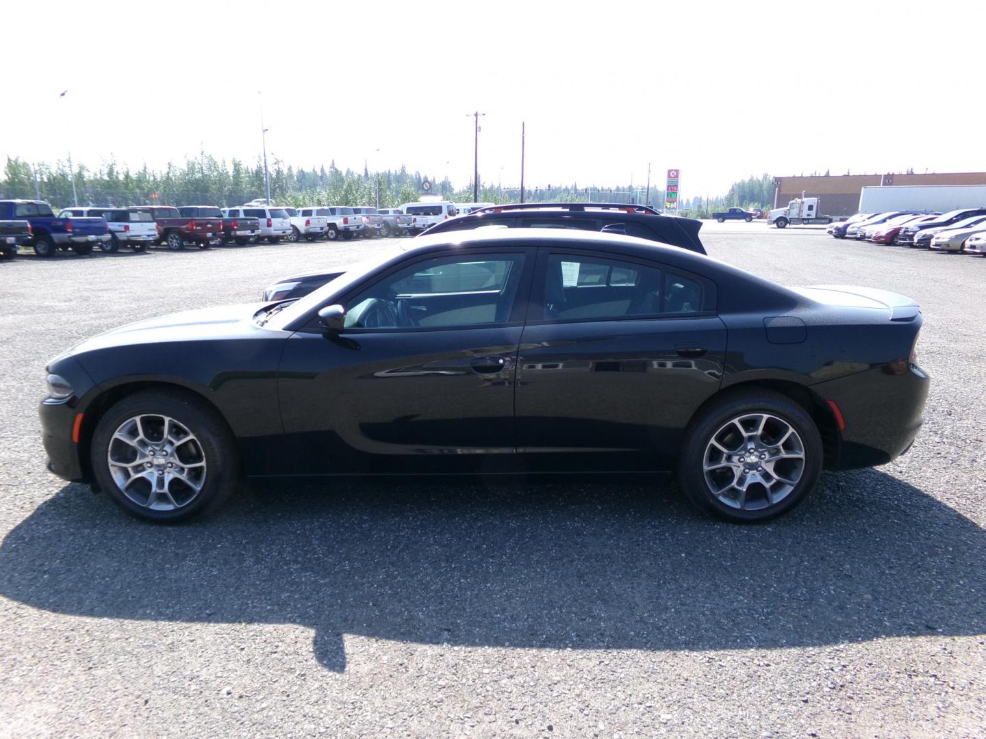 2015 Black Dodge Charger SXT AWD (2C3CDXJG1FH) with an 3.6L V6 DOHC 24V engine, 8-Speed Automatic transmission, located at 2630 Philips Field Rd., Fairbanks, AK, 99709, (907) 458-0593, 64.848068, -147.780609 - Photo#2