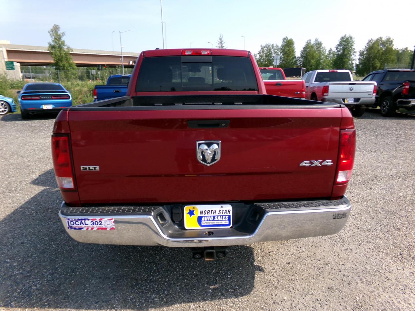 2013 Red Dodge 1500 SLT Quad Cab 4WD (1C6RR7GT5DS) with an 5.7L V8 OHV 16V engine, 6-Speed Automatic transmission, located at 2630 Philips Field Rd., Fairbanks, AK, 99709, (907) 458-0593, 64.848068, -147.780609 - Photo#3