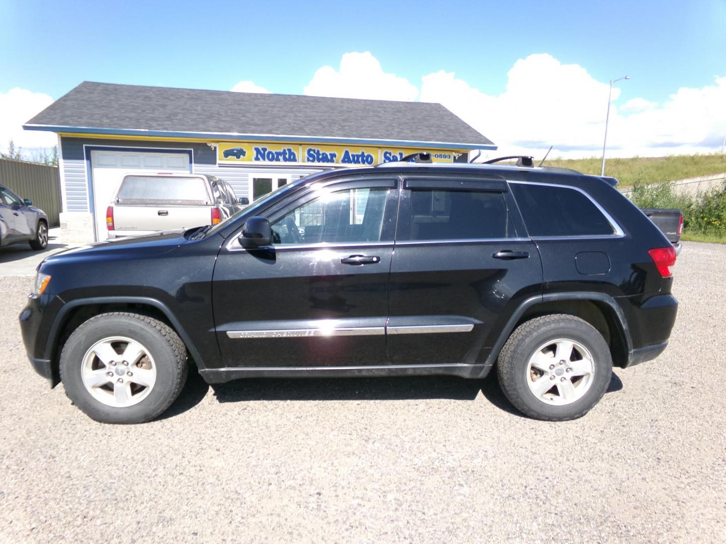 2013 Black Jeep Grand Cherokee Laredo 4WD (1C4RJFAGXDC) with an 3.6L V6 DOHC 24V engine, 5-Speed Automatic transmission, located at 2630 Philips Field Rd., Fairbanks, AK, 99709, (907) 458-0593, 64.848068, -147.780609 - Photo#2