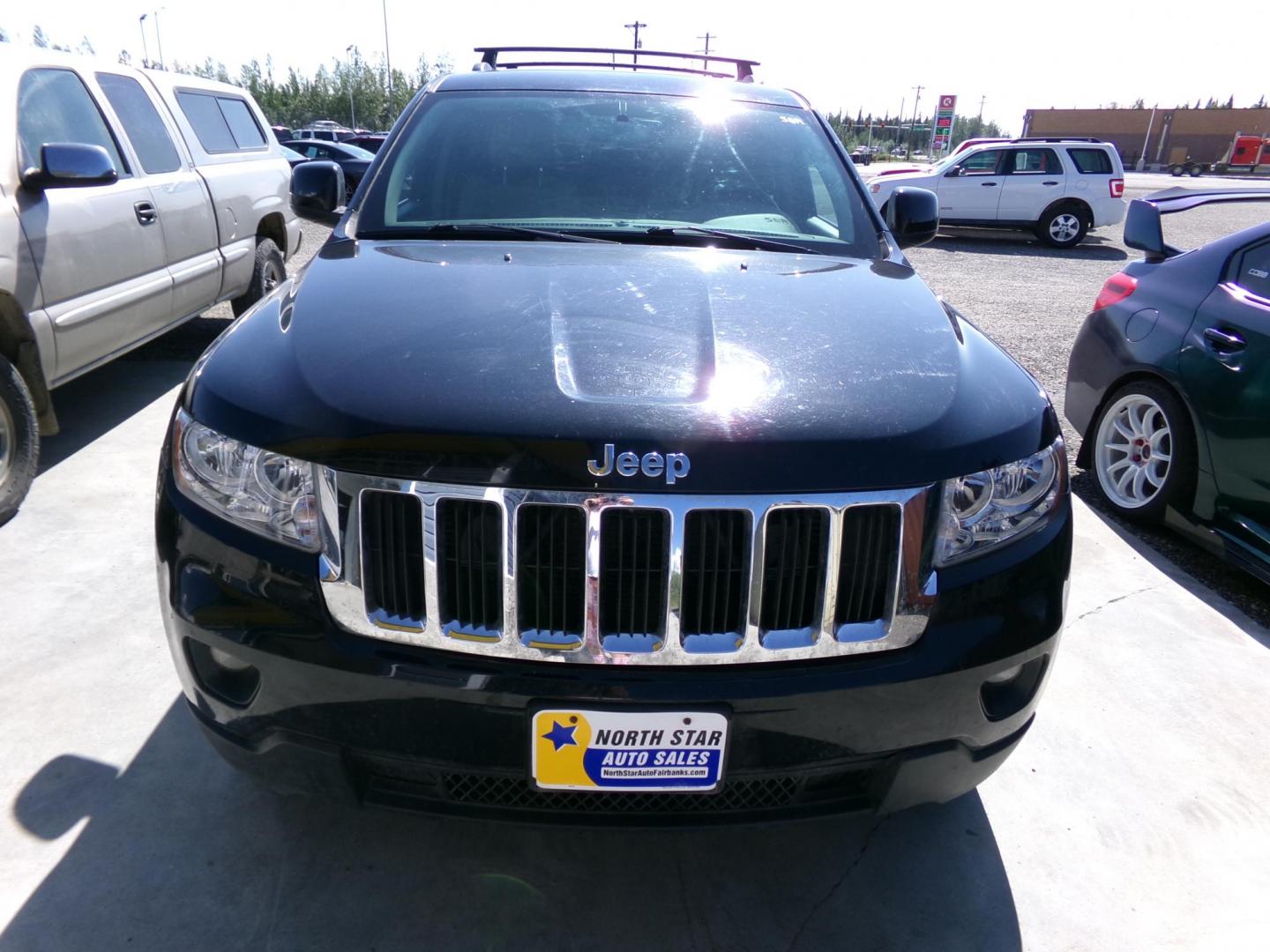 2013 Black Jeep Grand Cherokee Laredo 4WD (1C4RJFAGXDC) with an 3.6L V6 DOHC 24V engine, 5-Speed Automatic transmission, located at 2630 Philips Field Rd., Fairbanks, AK, 99709, (907) 458-0593, 64.848068, -147.780609 - Photo#1