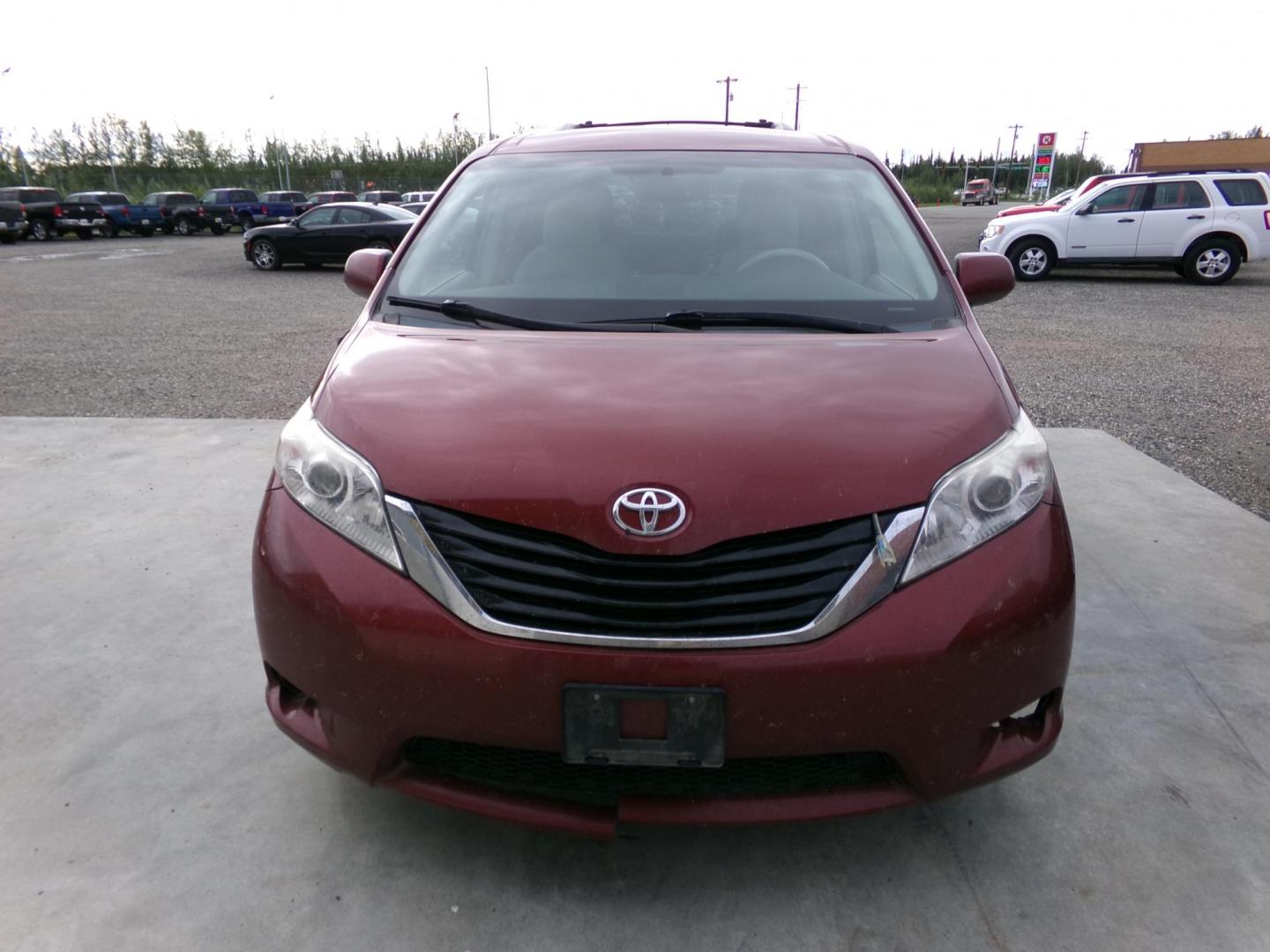 2014 Red Toyota Sienna LE AWD 7-Passenger V6 (5TDJK3DC8ES) with an 3.5L V6 EFI DOHC 24V engine, 5-Speed Automatic transmission, located at 2630 Philips Field Rd., Fairbanks, AK, 99709, (907) 458-0593, 64.848068, -147.780609 - Photo#1
