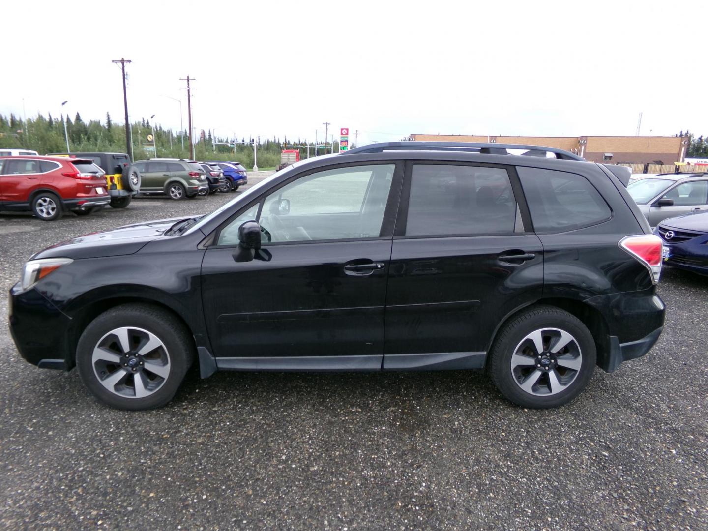 2017 Black Subaru Forester 2.5i Premium PZEV CVT (JF2SJAEC3HH) with an 2.5L H4 SOHC 16V engine, CVT transmission, located at 2630 Philips Field Rd., Fairbanks, AK, 99709, (907) 458-0593, 64.848068, -147.780609 - Photo#2
