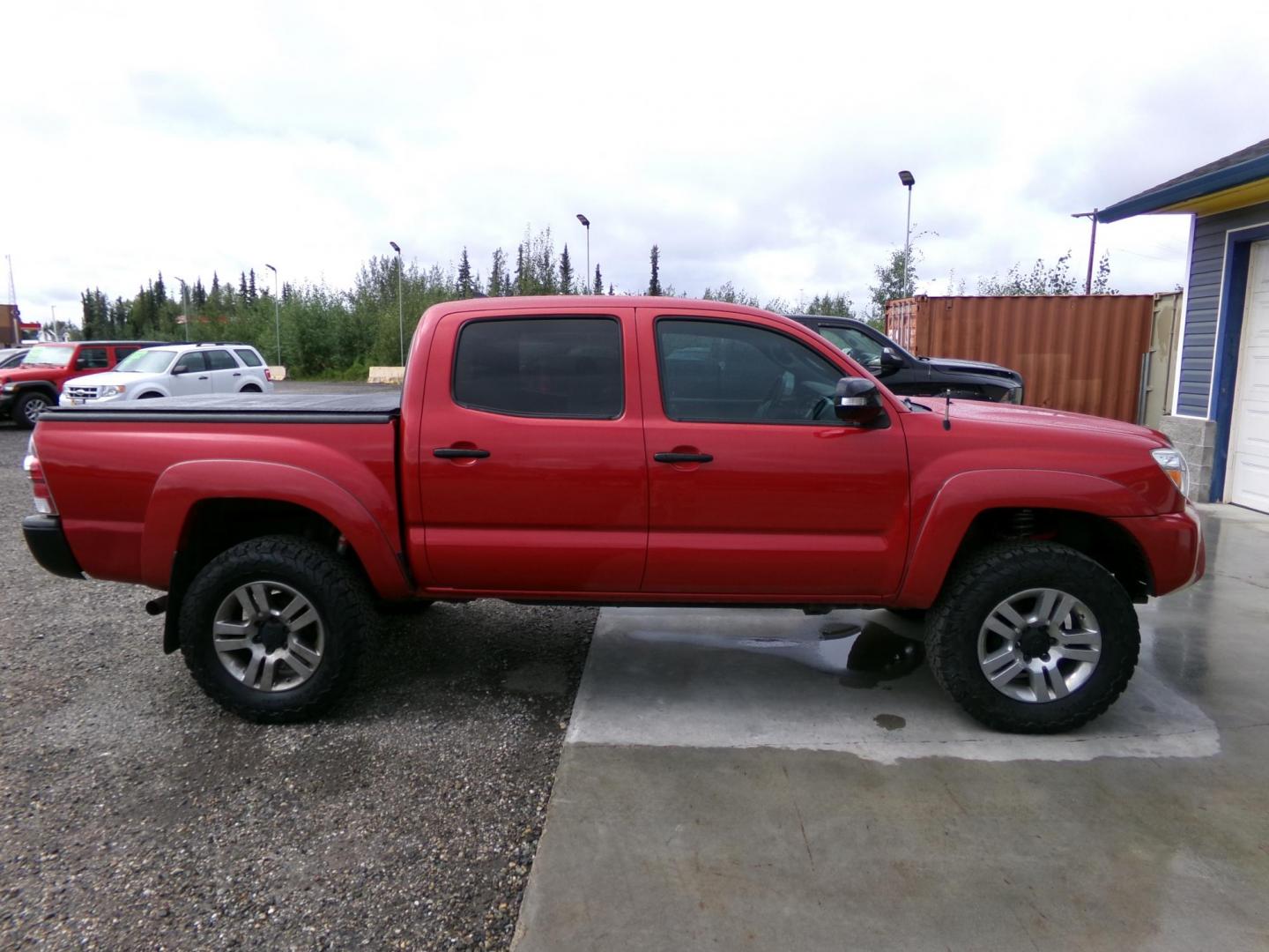 2013 Red /Grey Toyota Tacoma Double Cab V6 4WD (3TMLU4EN0DM) with an 4.0L V6 DOHC 24V engine, 6-Speed Automatic transmission, located at 2630 Philips Field Rd., Fairbanks, AK, 99709, (907) 458-0593, 64.848068, -147.780609 - Photo#2