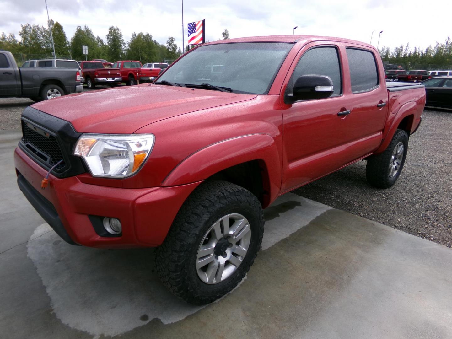 2013 Red /Grey Toyota Tacoma Double Cab V6 4WD (3TMLU4EN0DM) with an 4.0L V6 DOHC 24V engine, 6-Speed Automatic transmission, located at 2630 Philips Field Rd., Fairbanks, AK, 99709, (907) 458-0593, 64.848068, -147.780609 - Photo#0