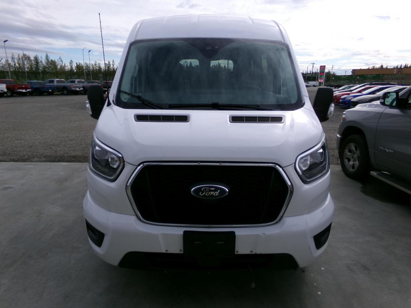 2021 White Ford Transit 350 Wagon Med. Roof XL w/Sliding Pass. 148-in. WB (1FBAX9C85MK) with an 3.5L V6 DOHC 24V engine, 6A transmission, located at 2630 Philips Field Rd., Fairbanks, AK, 99709, (907) 458-0593, 64.848068, -147.780609 - Photo#1