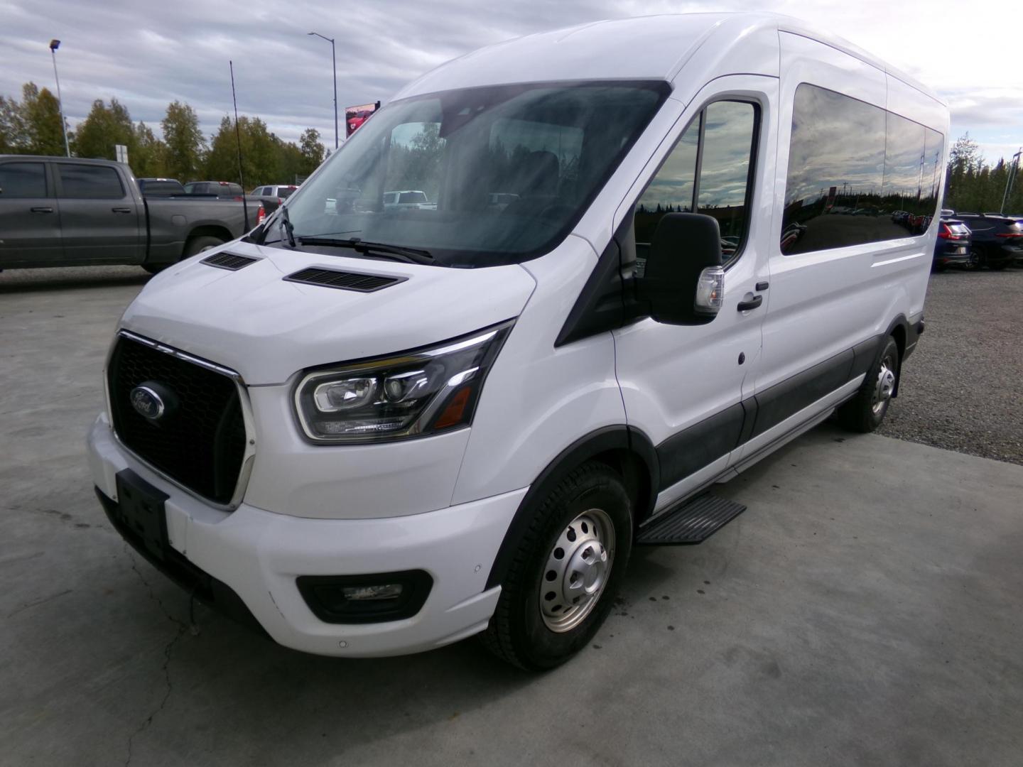 2021 White Ford Transit 350 Wagon Med. Roof XL w/Sliding Pass. 148-in. WB (1FBAX9C85MK) with an 3.5L V6 DOHC 24V engine, 6A transmission, located at 2630 Philips Field Rd., Fairbanks, AK, 99709, (907) 458-0593, 64.848068, -147.780609 - Photo#0