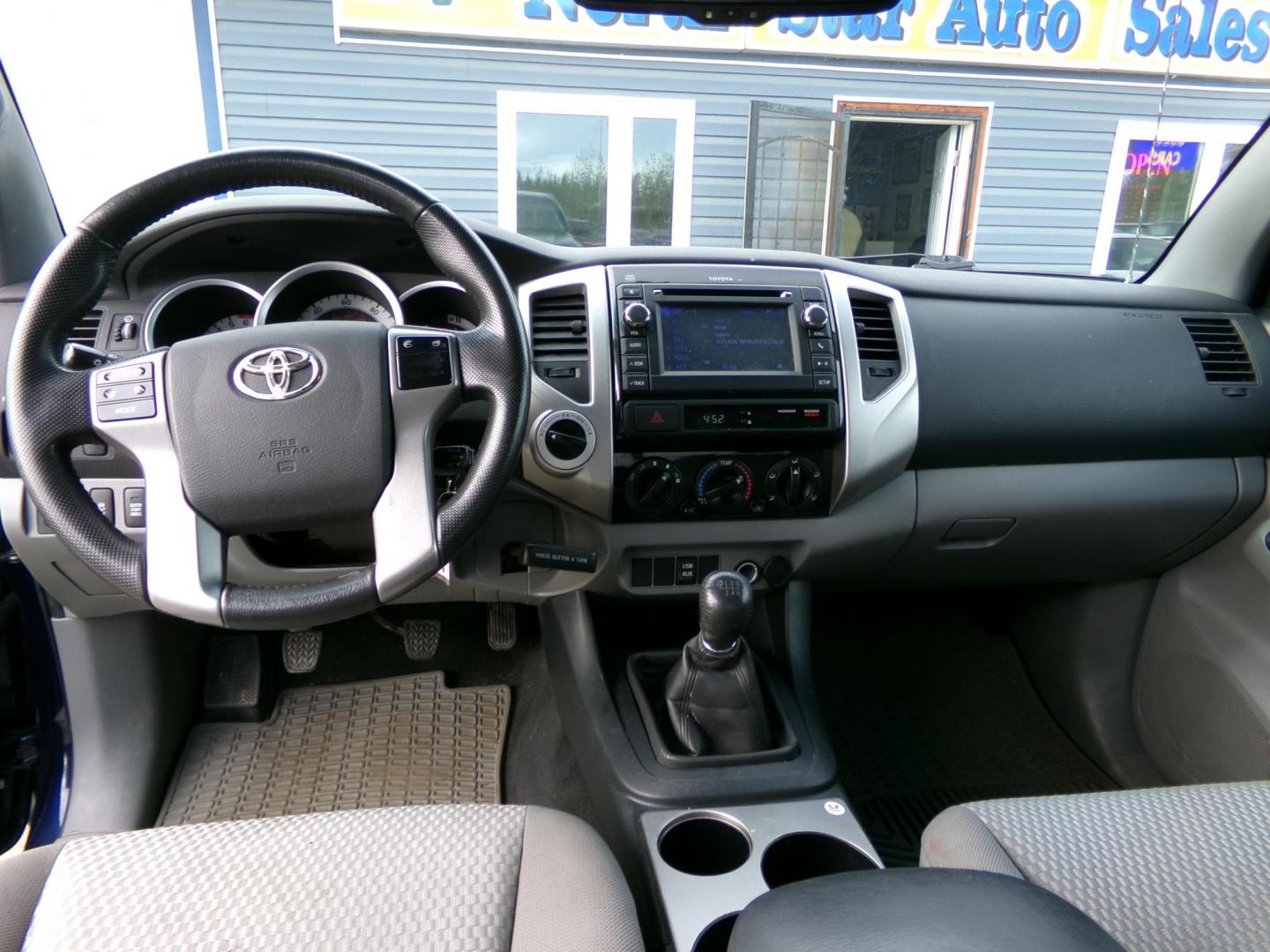 2013 Blue /Grey Toyota Tacoma Access Cab V6 4WD (5TFUU4ENXDX) with an 4.0L V6 DOHC 24V engine, 6-Speed Manual transmission, located at 2630 Philips Field Rd., Fairbanks, AK, 99709, (907) 458-0593, 64.848068, -147.780609 - Photo#7