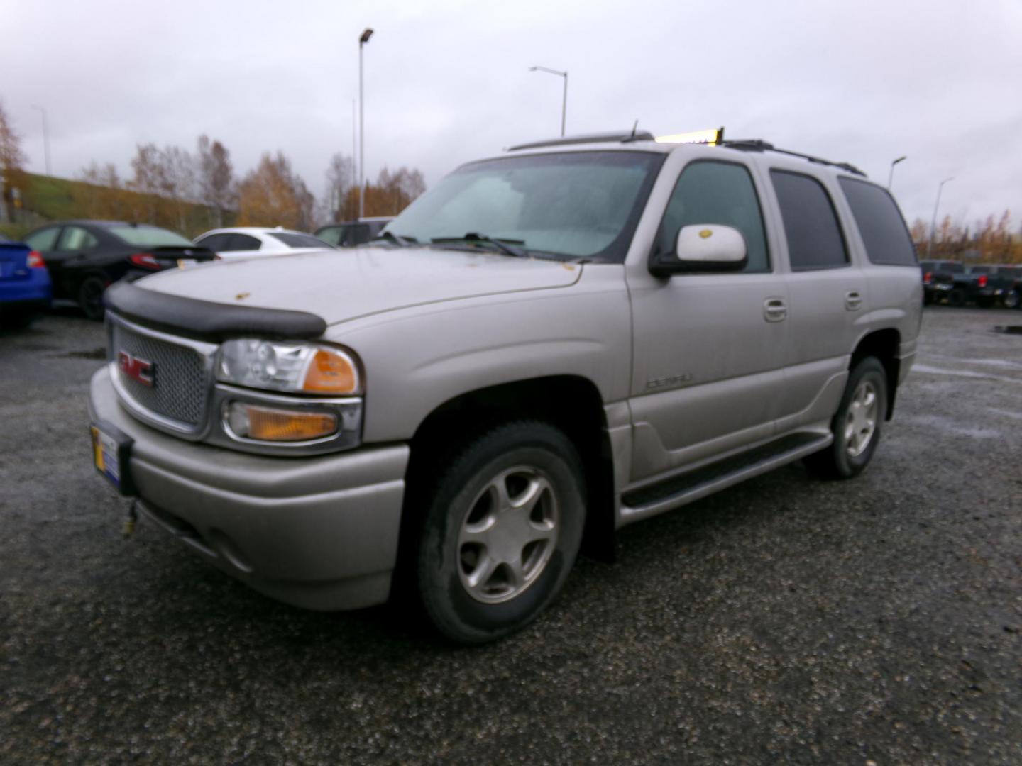 2004 Gold GMC Yukon Denali Base (1GKEK63UX4J) with an 6.0L V8 OHV 16V engine, 4-Speed Automatic Overdrive transmission, located at 2630 Philips Field Rd., Fairbanks, AK, 99709, (907) 458-0593, 64.848068, -147.780609 - Photo#0