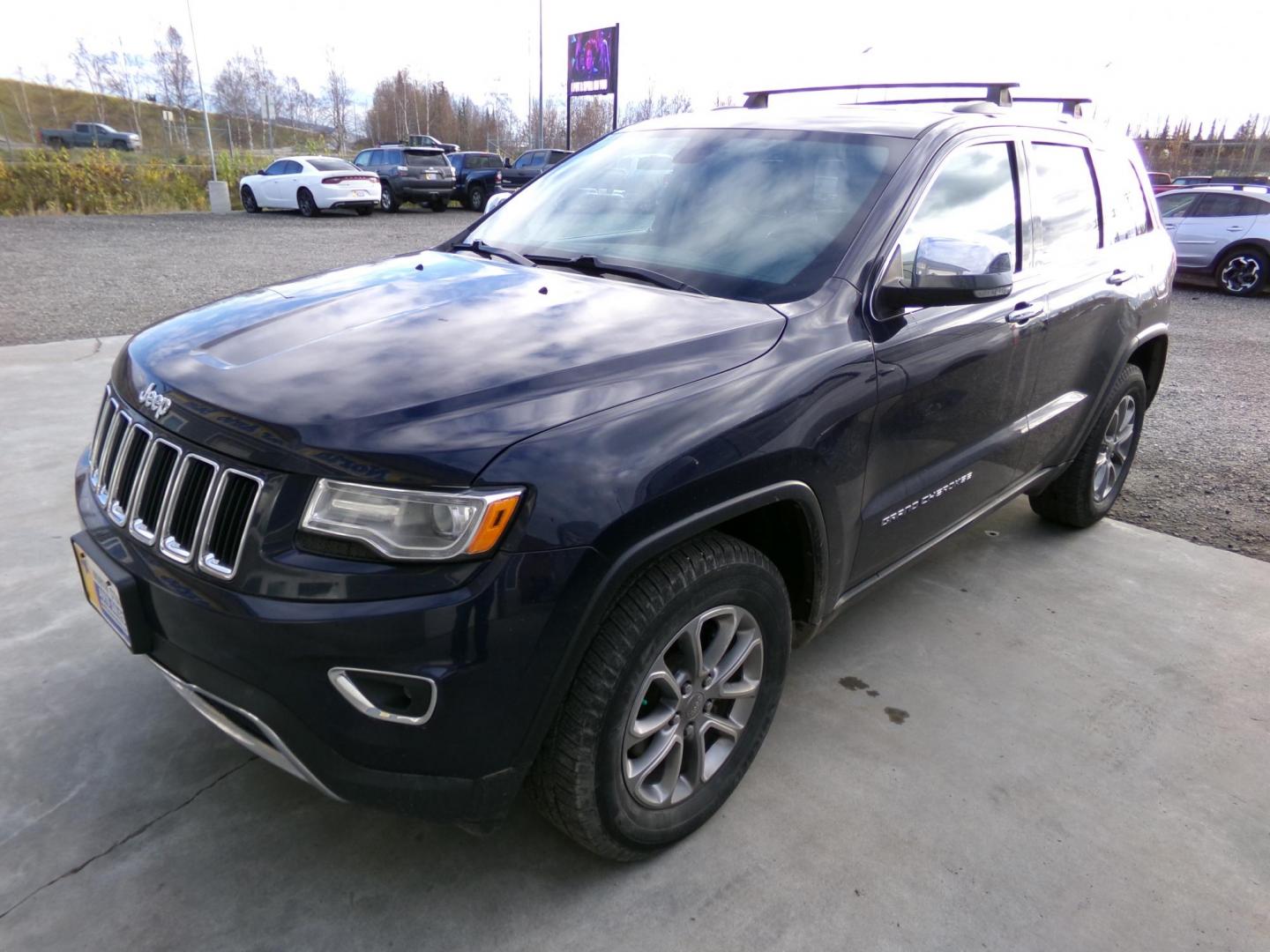 2015 Blue Jeep Grand Cherokee Limited 4WD (1C4RJFBG8FC) with an 3.6L V6 DOHC 24V engine, 8-Speed Automatic transmission, located at 2630 Philips Field Rd., Fairbanks, AK, 99709, (907) 458-0593, 64.848068, -147.780609 - Photo#0