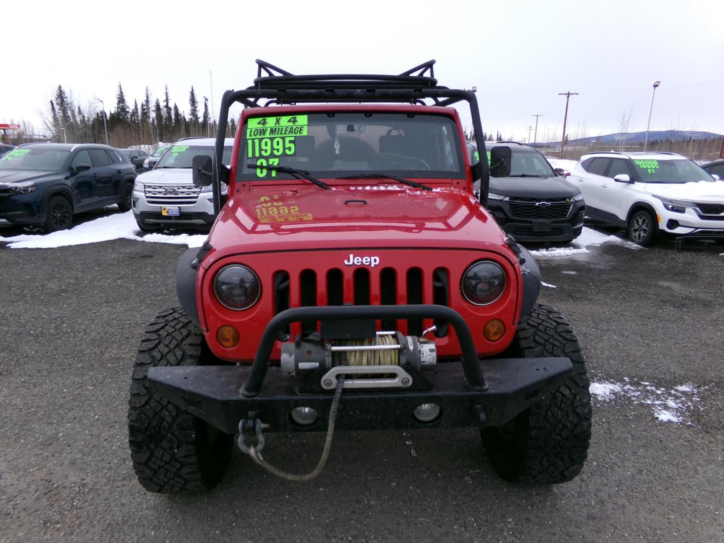 2007 Red Jeep Wrangler Rubicon (1J4GA64137L) with an 3.8L V6 OHV 12V engine, located at 2630 Philips Field Rd., Fairbanks, AK, 99709, (907) 458-0593, 64.848068, -147.780609 - Photo#1