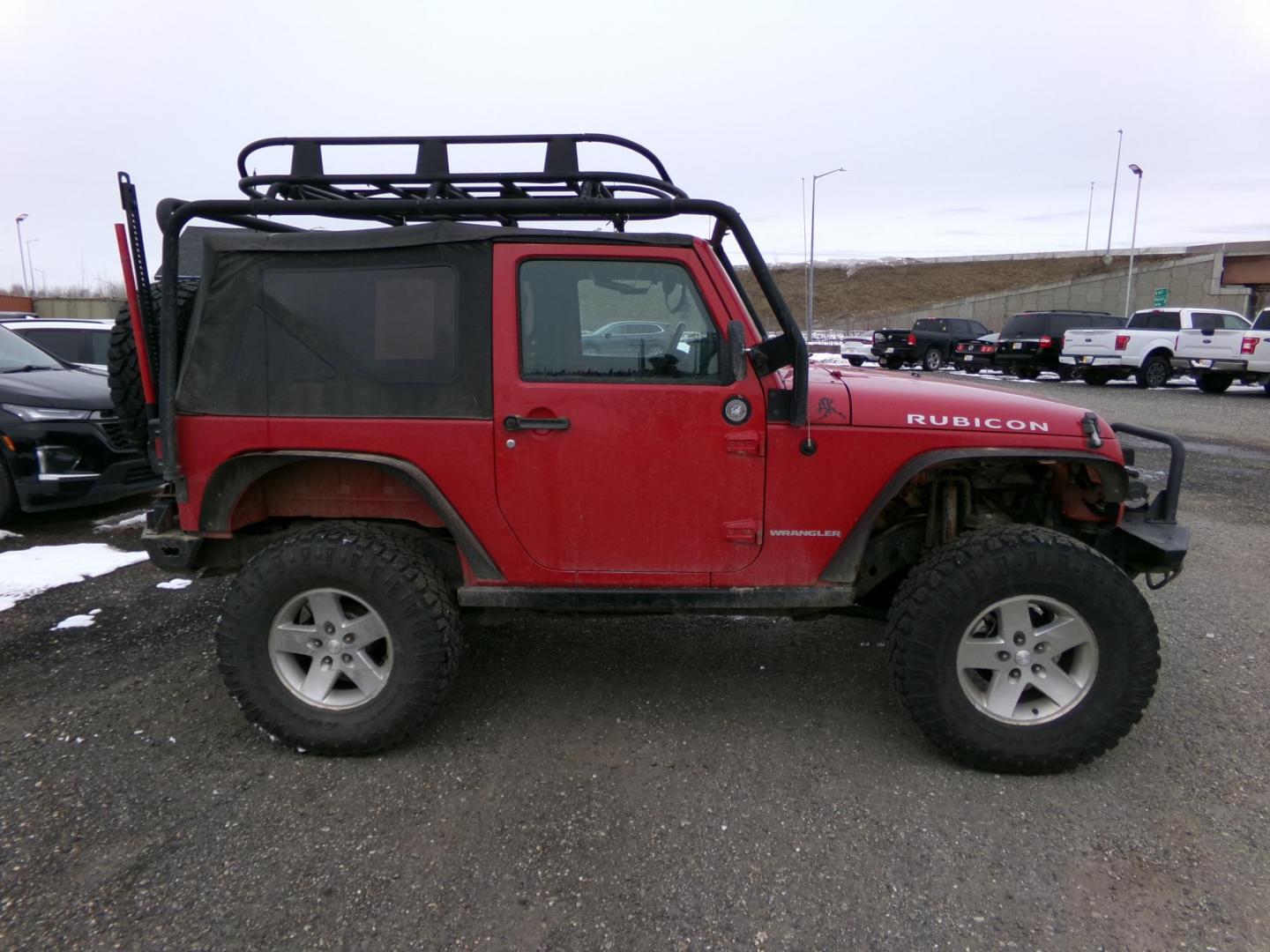 2007 Red Jeep Wrangler Rubicon (1J4GA64137L) with an 3.8L V6 OHV 12V engine, located at 2630 Philips Field Rd., Fairbanks, AK, 99709, (907) 458-0593, 64.848068, -147.780609 - Photo#2