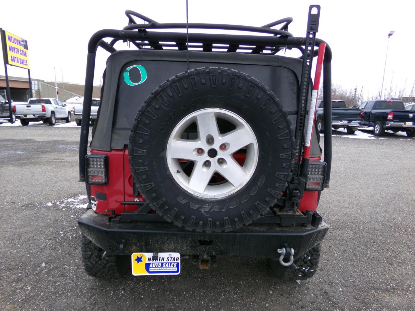 2007 Red Jeep Wrangler Rubicon (1J4GA64137L) with an 3.8L V6 OHV 12V engine, located at 2630 Philips Field Rd., Fairbanks, AK, 99709, (907) 458-0593, 64.848068, -147.780609 - Photo#3