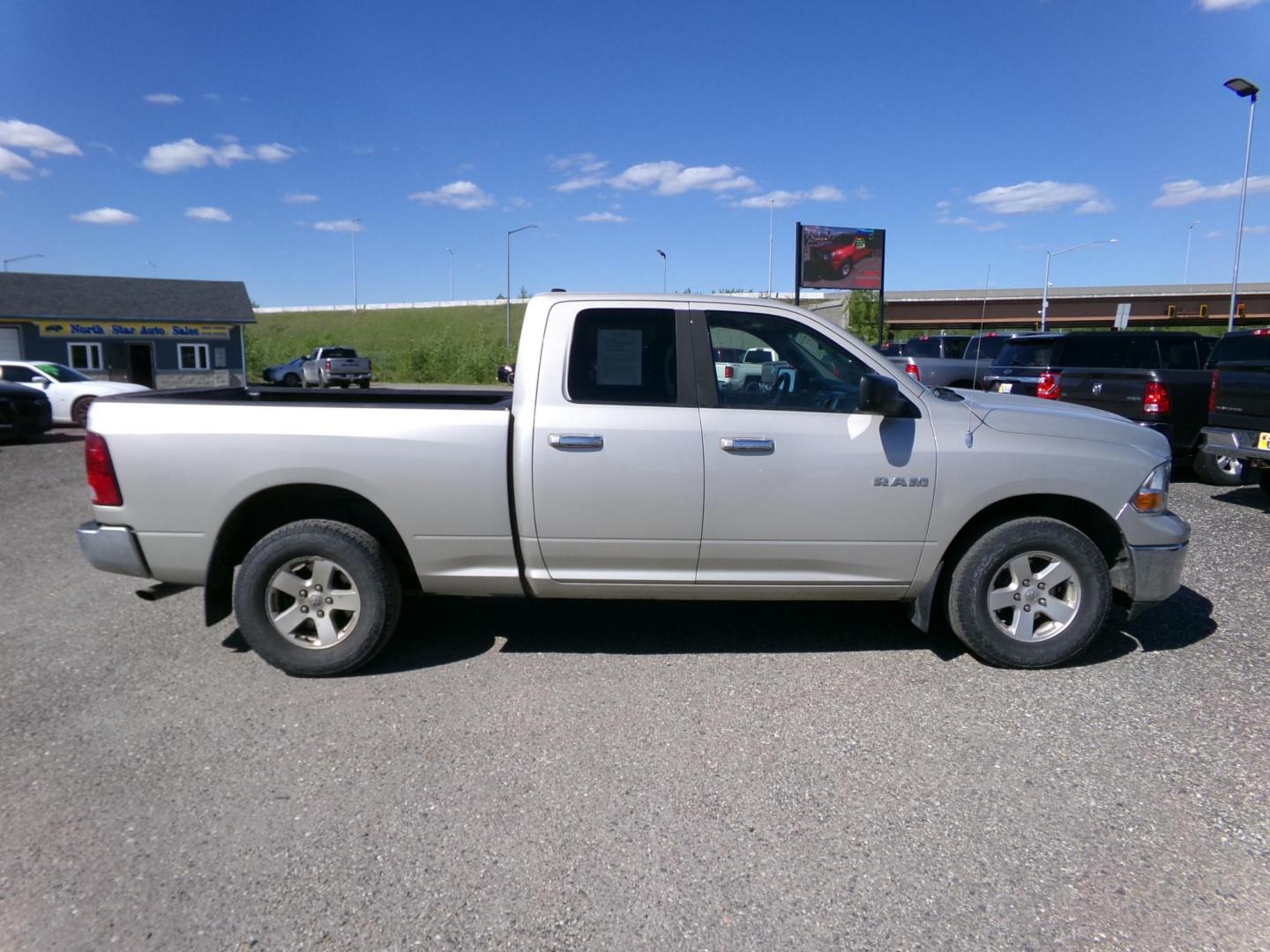 2010 Gold Dodge Ram 1500 Laramie Quad Cab 4WD (1D7RV1GP2AS) with an 4.7L V8 SOHC 16V FFV engine, 5-Speed Automatic transmission, located at 2630 Philips Field Rd., Fairbanks, AK, 99709, (907) 458-0593, 64.848068, -147.780609 - Photo#2
