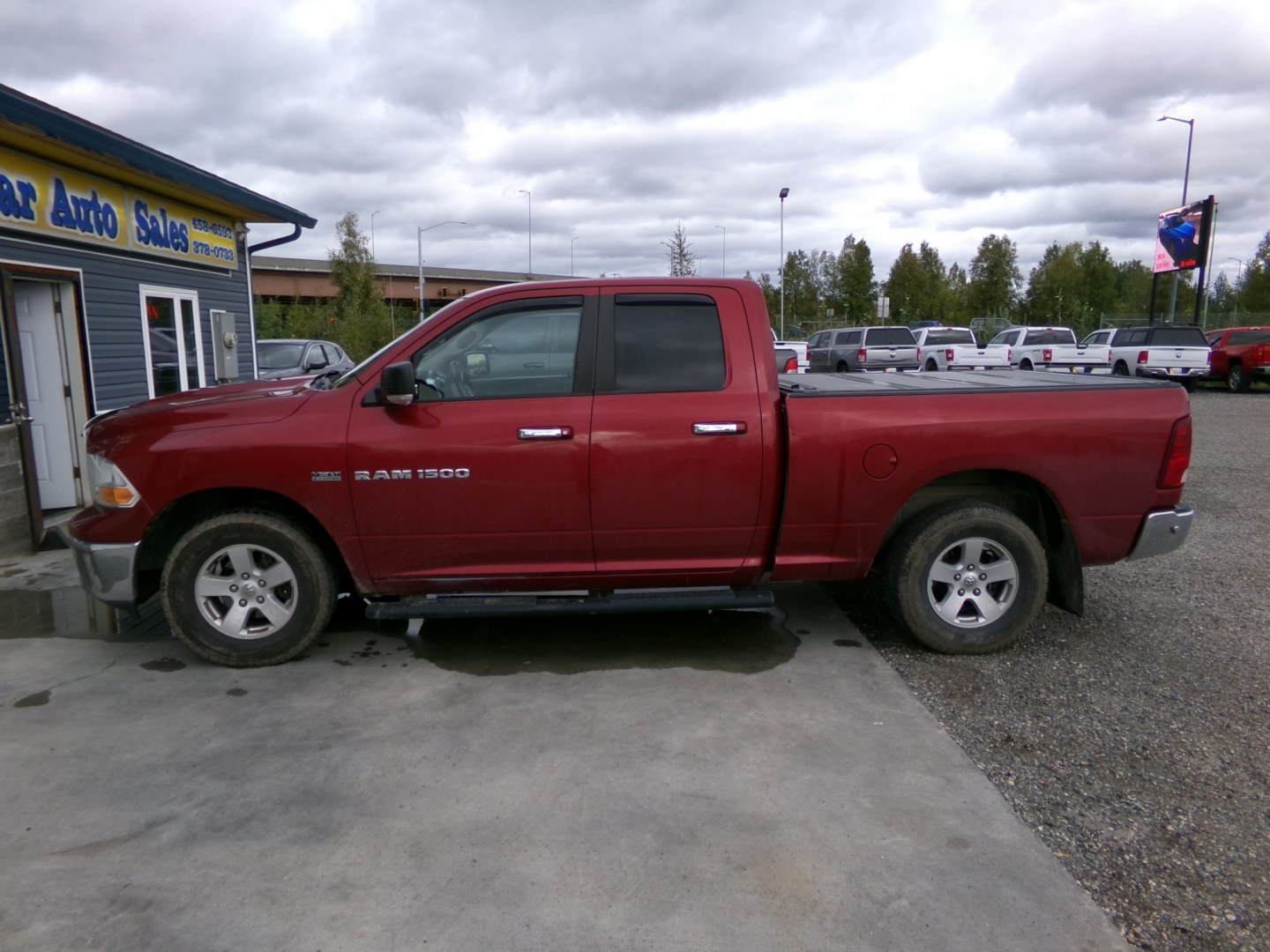 2011 Red Dodge Ram 1500 Sport Quad Cab 4WD (1D7RV1GT2BS) with an 5.7L V8 OHV 16V engine, 5-Speed Automatic transmission, located at 2630 Philips Field Rd., Fairbanks, AK, 99709, (907) 458-0593, 64.848068, -147.780609- Photo#2