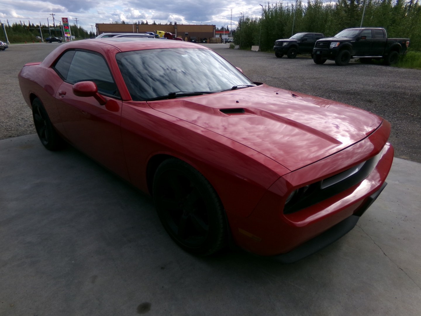 2012 Red Dodge Challenger SXT (2C3CDYAG5CH) with an 3.6L V6 DOHC 24V engine, 4-Speed Automatic transmission, located at 2630 Philips Field Rd., Fairbanks, AK, 99709, (907) 458-0593, 64.848068, -147.780609- Photo#0