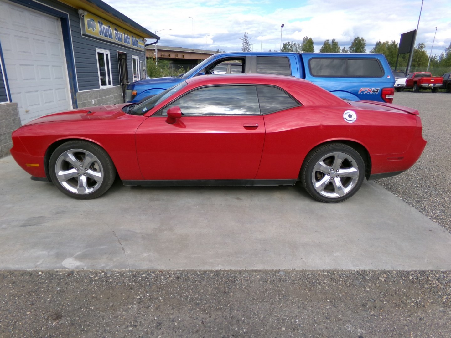 2012 Red Dodge Challenger SXT (2C3CDYAG5CH) with an 3.6L V6 DOHC 24V engine, 4-Speed Automatic transmission, located at 2630 Philips Field Rd., Fairbanks, AK, 99709, (907) 458-0593, 64.848068, -147.780609- Photo#2