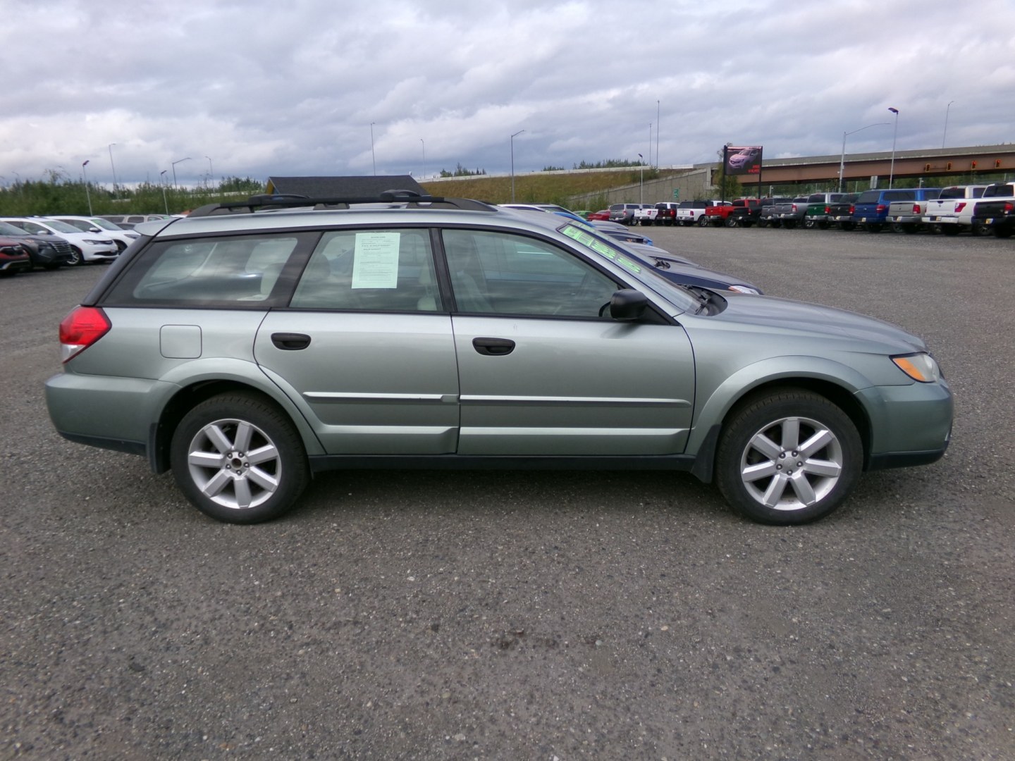 2009 Blue Subaru Outback 2.5i (4S4BP61C396) with an 2.5L H4 SOHC 16V engine, 4A transmission, located at 2630 Philips Field Rd., Fairbanks, AK, 99709, (907) 458-0593, 64.848068, -147.780609- Photo#2