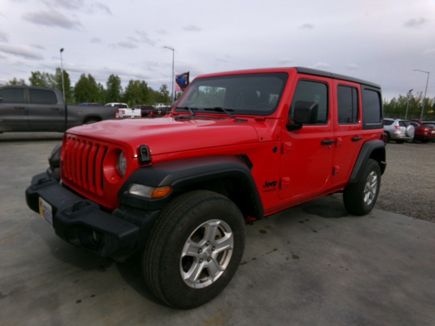2022 Red Jeep Wrangler Unlimited Sport (1C4HJXDG2NW) with an 3.6L V6 DOHC 24V FFV engine, 6A transmission, located at 2630 Philips Field Rd., Fairbanks, AK, 99709, (907) 458-0593, 64.848068, -147.780609- Photo#0