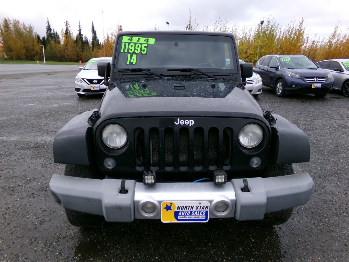 2014 Black Jeep Wrangler Unlimited Sahara 4WD (1C4BJWEG1EL) with an 3.6L V6 DOHC 24V FFV engine, 6-Speed Manual transmission, located at 2630 Philips Field Rd., Fairbanks, AK, 99709, (907) 458-0593, 64.848068, -147.780609- Photo#1