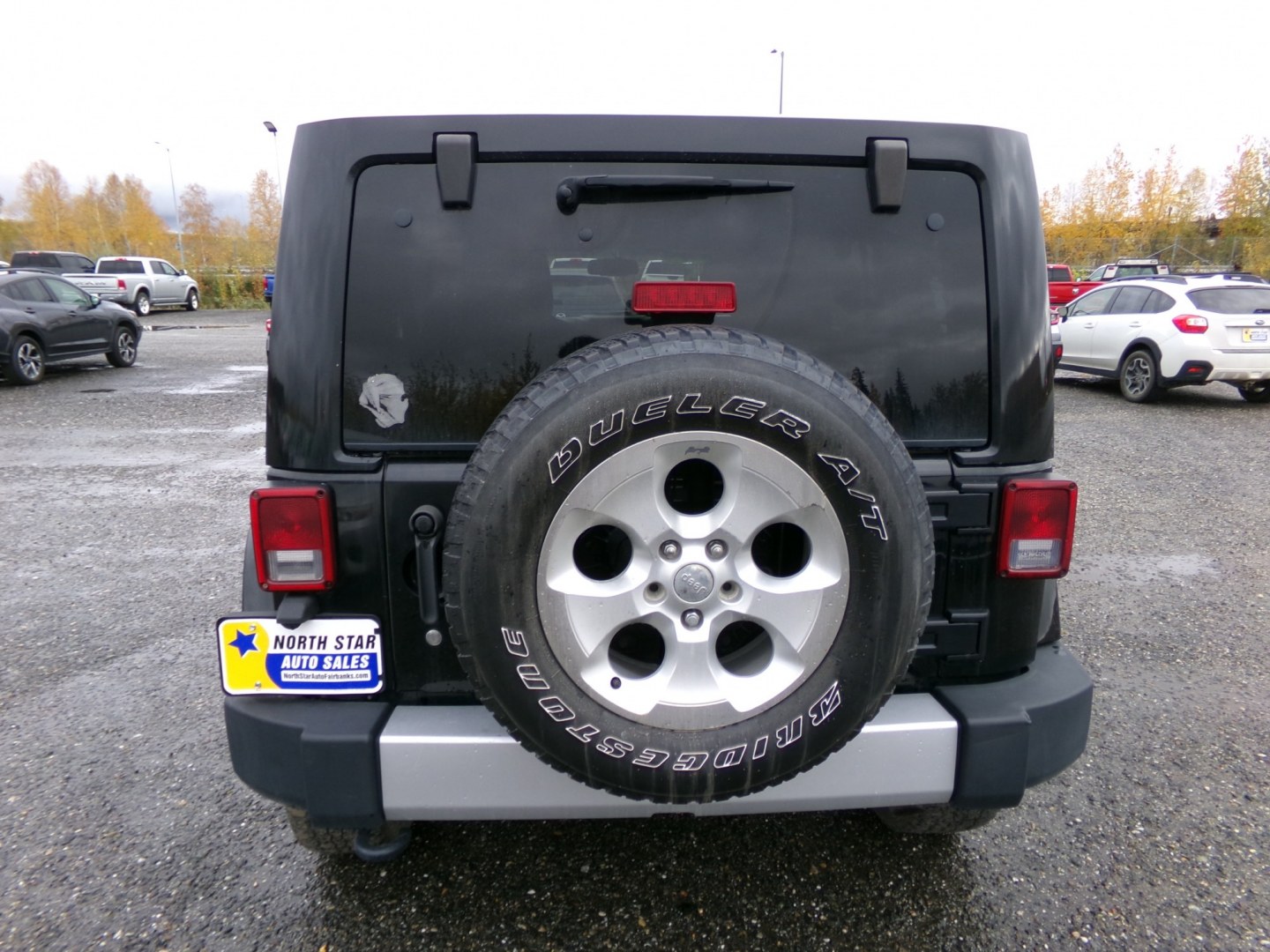 2014 Black Jeep Wrangler Unlimited Sahara 4WD (1C4BJWEG1EL) with an 3.6L V6 DOHC 24V FFV engine, 6-Speed Manual transmission, located at 2630 Philips Field Rd., Fairbanks, AK, 99709, (907) 458-0593, 64.848068, -147.780609- Photo#3