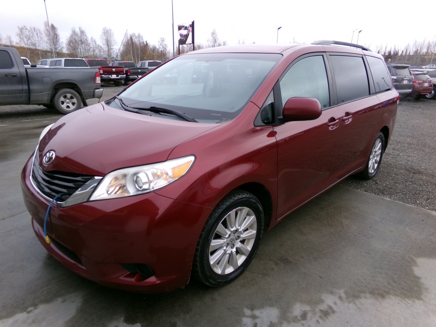 2012 Red Toyota Sienna LE AWD 7-Passenger V6 (5TDJK3DC7CS) with an 3.5L V6 EFI DOHC 24V engine, 5-Speed Automatic transmission, located at 2630 Philips Field Rd., Fairbanks, AK, 99709, (907) 458-0593, 64.848068, -147.780609- Photo#0